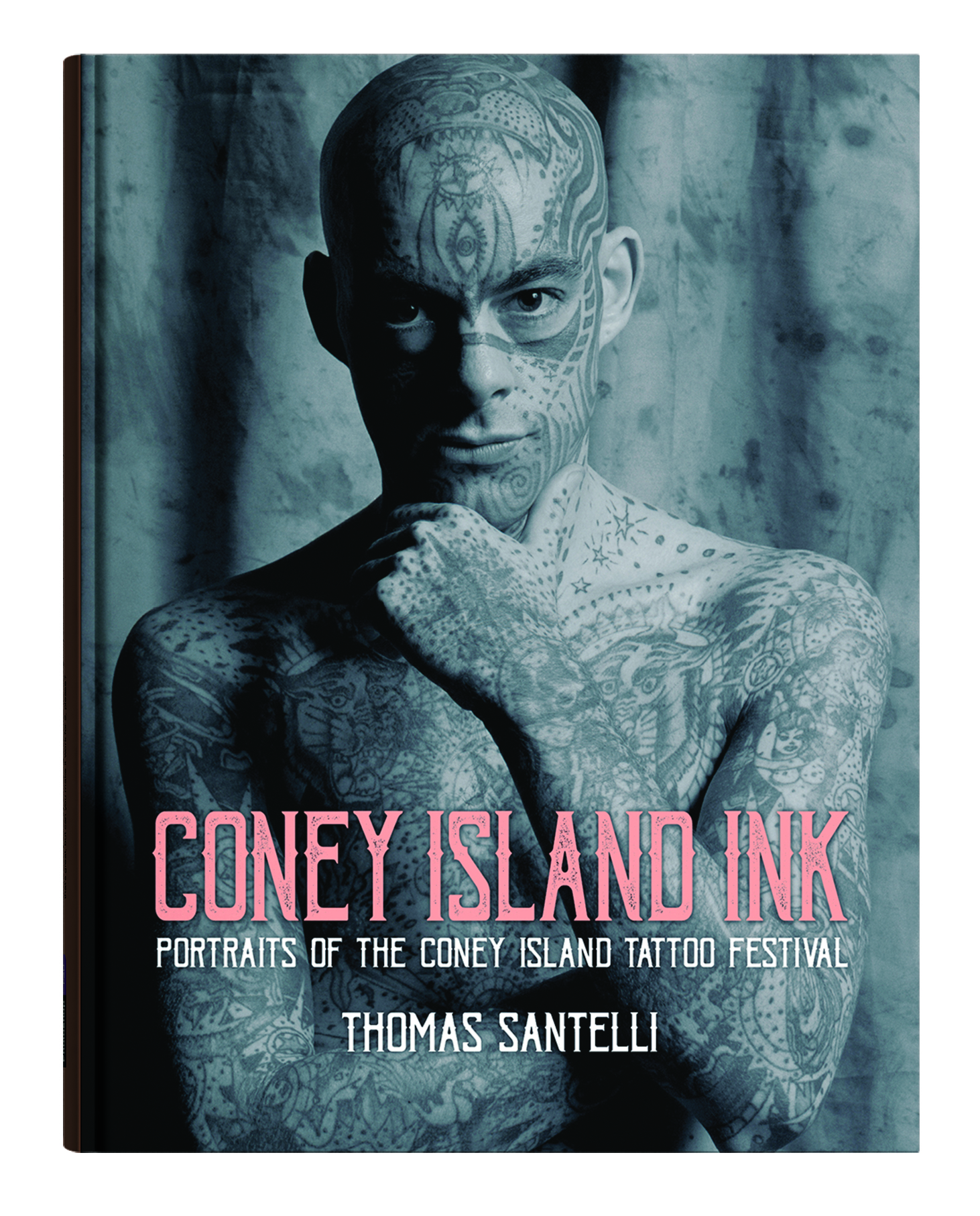 Book cover of Coney Island Ink: Portraits of the Coney Island Tattoo Festival depicts a heavily tattooed bald male figure cupping his chin in his hand and smiling slightly, making eye contact with the viewer