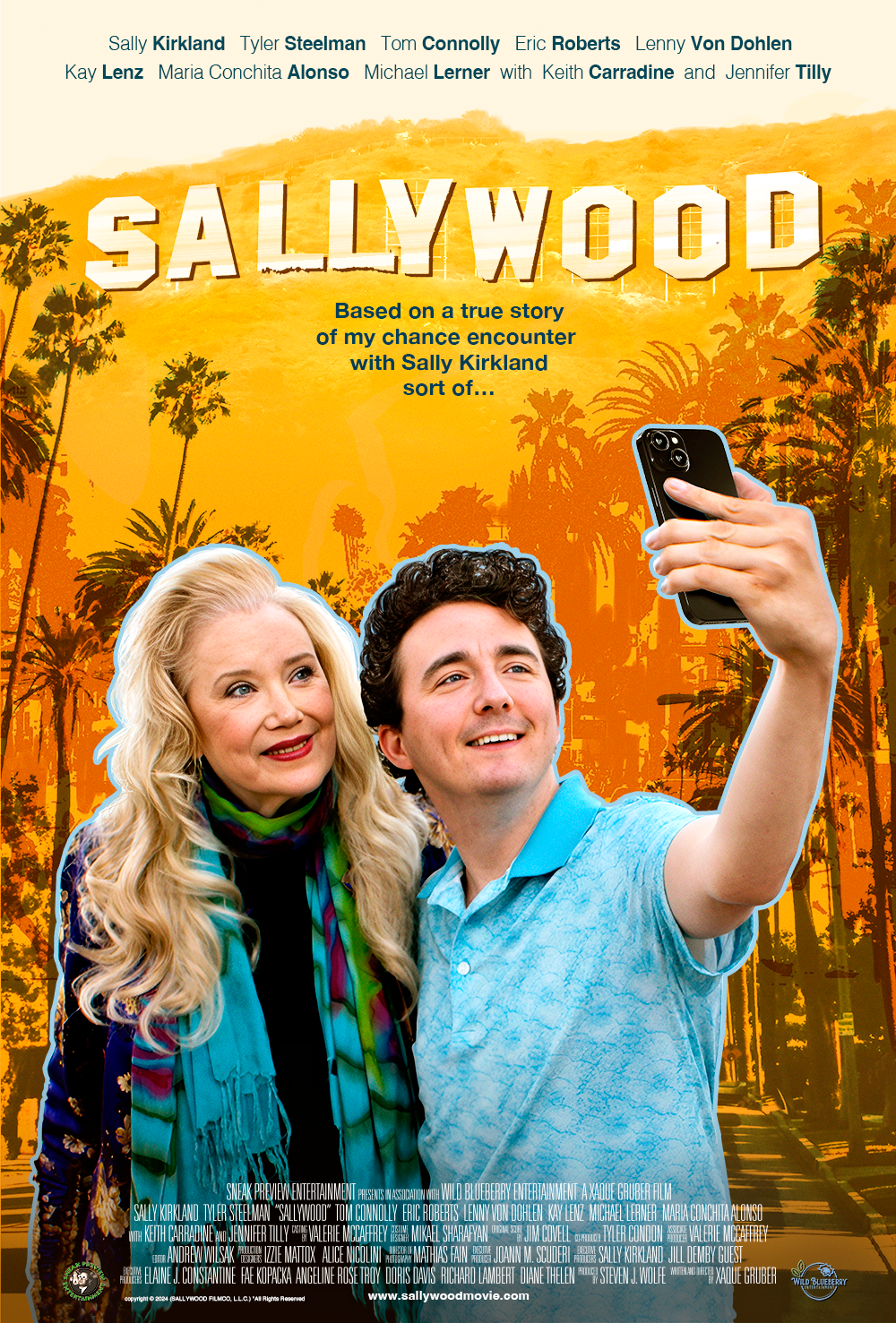 Poster for the film Sallywood depicts actress and producer Sally Kirkland standing next to Tyler Steelman, who is taking a selfie of them both. They stand under the silhouette of the Hollywood Hills, with the iconic 