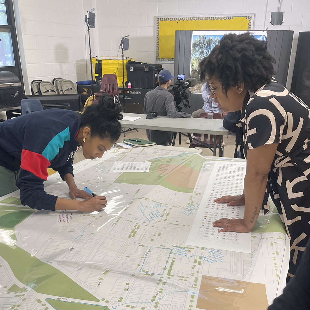 Students looking over schematics