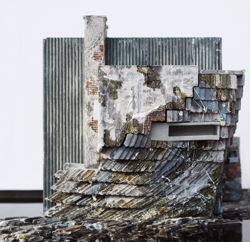 A hyper-realistic rendering of a shingled slope set in front of a corrugated steel wall. A chimney rises against the steel wall.