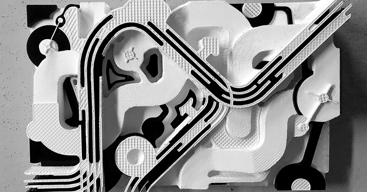 physical architectural model, resembles aerial view of train set