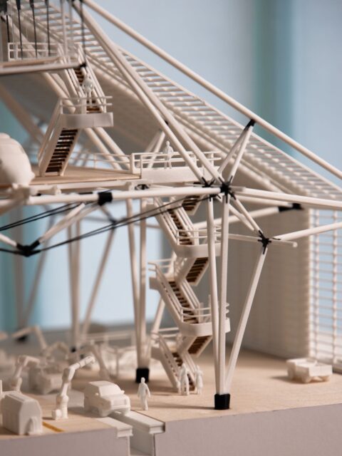 ARCH 806 | DESIGN 6: NORMAL STUDIO
Spring 2026 | Final Review Models
Professor Alexandra Barker
This architecture studio examines the design of a next-generation electric vehicle production plant as a complex territorial and civic project rather than a singular industrial object. The course centers on a large-scale manufacturing facility operating continuously in a peripheral landscape and asks how architecture can reconceptualize industrial sites as integrated environments where production, habitation, and public life intersect. Students investigate how spatial organization, logistics, environmental systems, and architectural form can operate together to support both industrial performance and social presence, treating the factory as an extended field of interdependent systems embedded within a broader ecological and regional context.
The studio is conducted through a combination of design exercises, precedent analysis, collective discussions, and iterative project development. Students work at multiple scales—from territorial planning and infrastructural organization to spatial sequences and environmental strategies—using drawings, physical models, and representational techniques to test ideas of horizontal organization, circulation, and programmatic integration. Emphasis is placed on understanding architecture as a continuous system of buildings, landscapes, and infrastructures, with particular attention to how voids, courtyards, circulation networks, and environmental mediation structure large, deep-plan environments.
Work by Students: 1-4: Noah Spivak 5-7: Lanling Shen & Jingyi Wang 8-9: Deniz Tokman & Begum Nar 10-12: Selina Yan 13: A-Yao Tseng
@n_spivak @vickyjin9_yi @deniztokmann @begumnarr @selina.k.y @t_yao_s
@alexandrabarker @hartmarlow @andrewjamesholder @quilianriano
#PrattMLA #PrattMArch #PrattInstitute #PrattGALAUD #PrattSOA @archdaily @archinect @next_top_architects @superarchitects @designboom @dezeen @architecturefactor