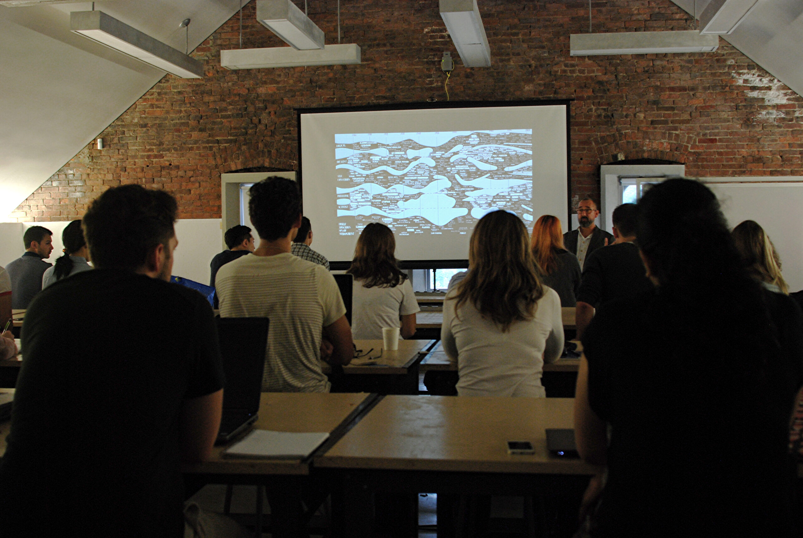 students watching presentation on projection screen