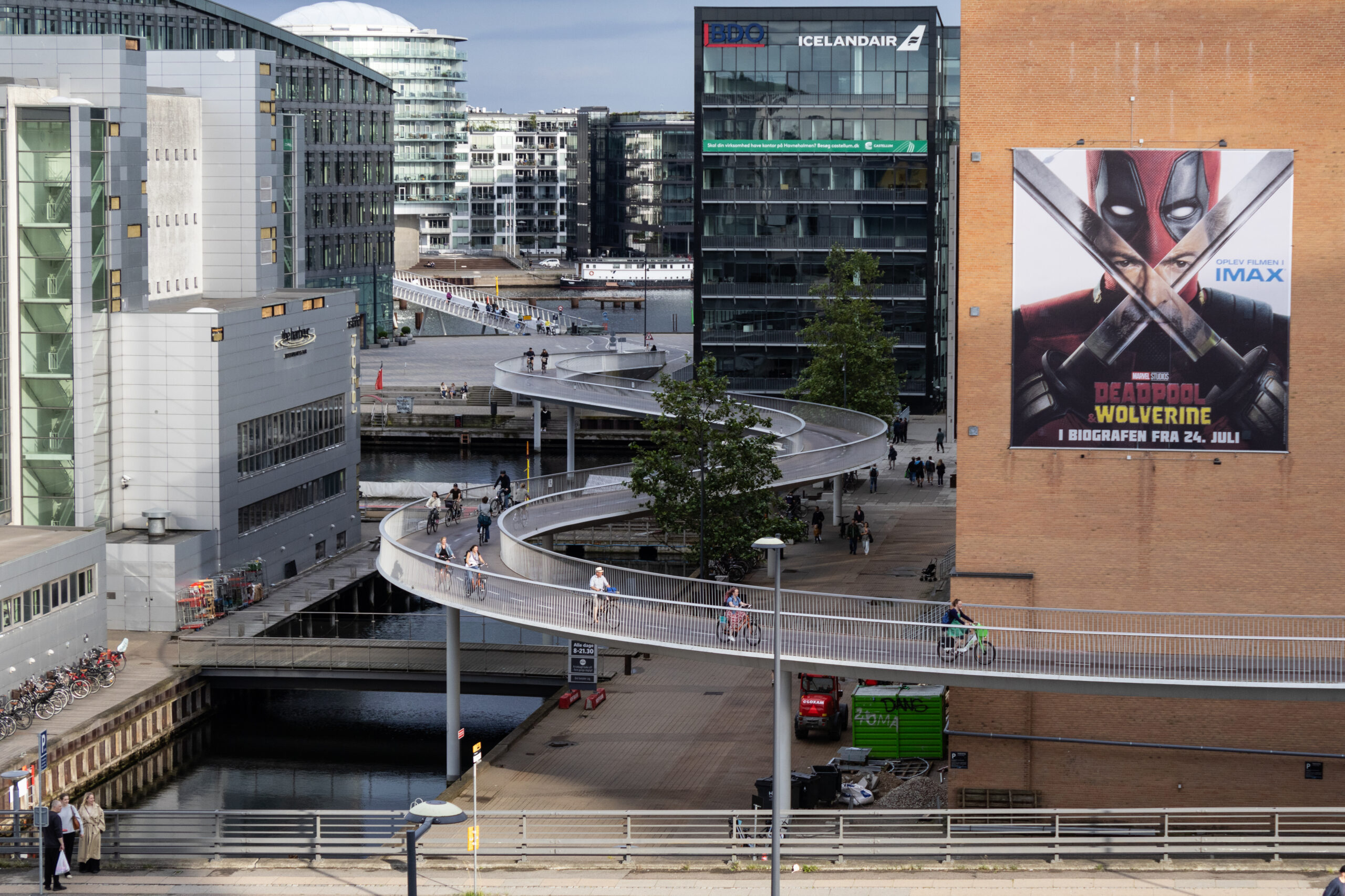 Bicycle riders on the winding Cykelslangen, or Bicycle Snake bridge, in Copenhagen.