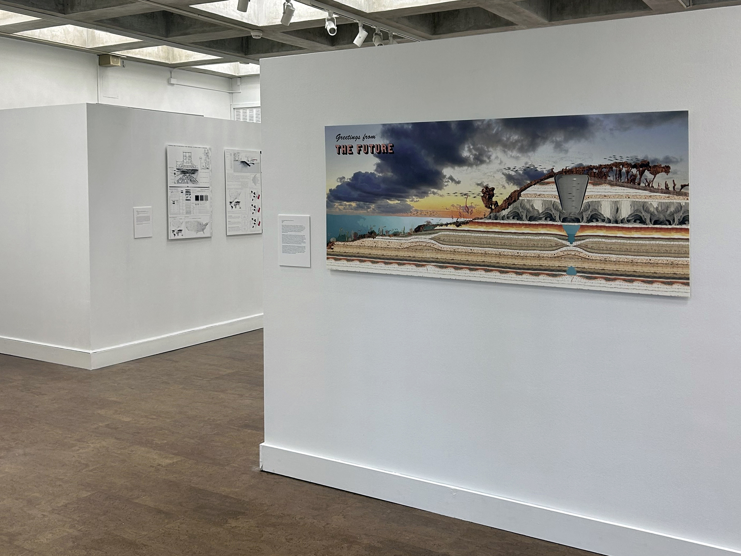 Interior view of a gallery with artwork hung on the walls