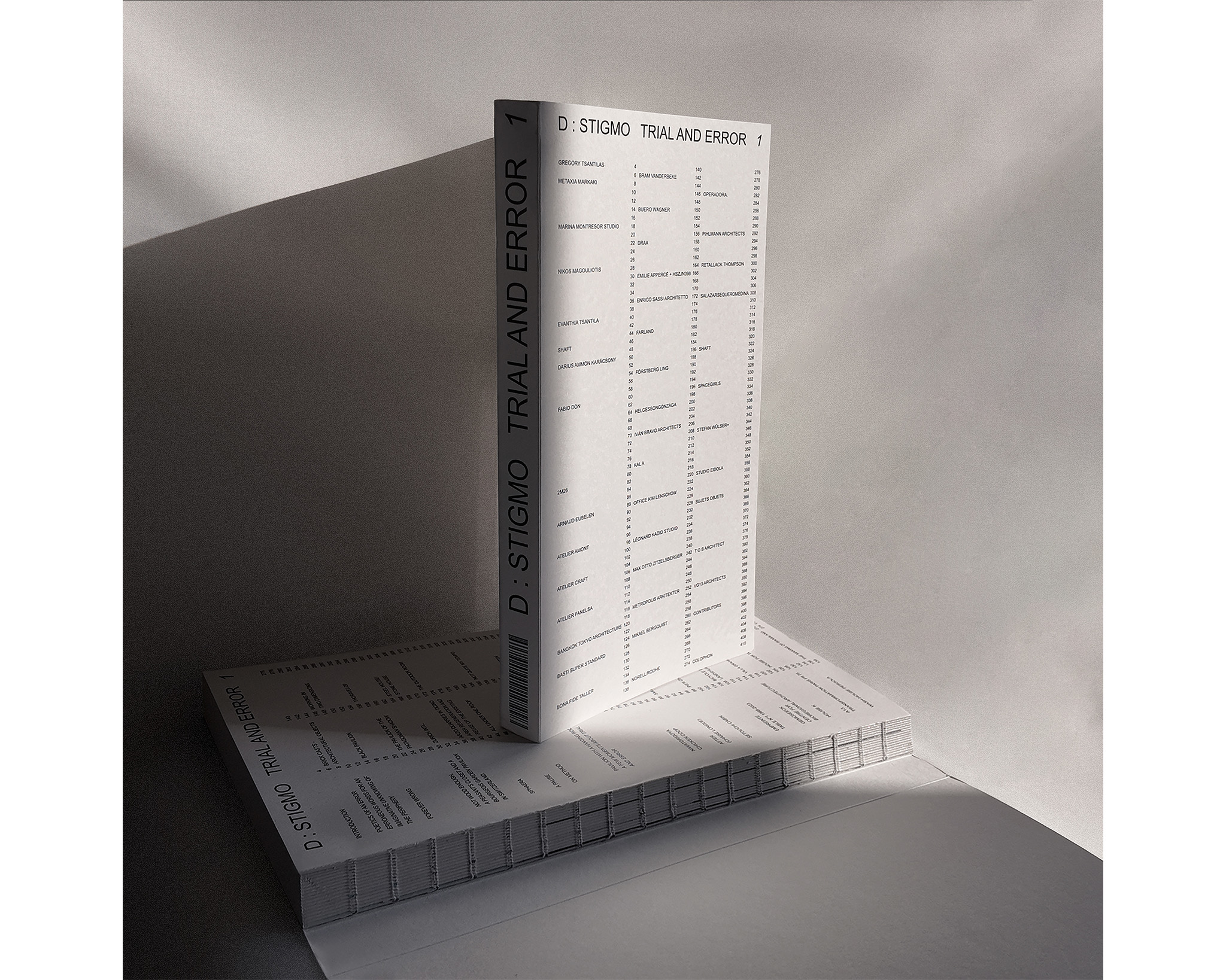 A stack of books is displayed, with the top book upright and featuring the title