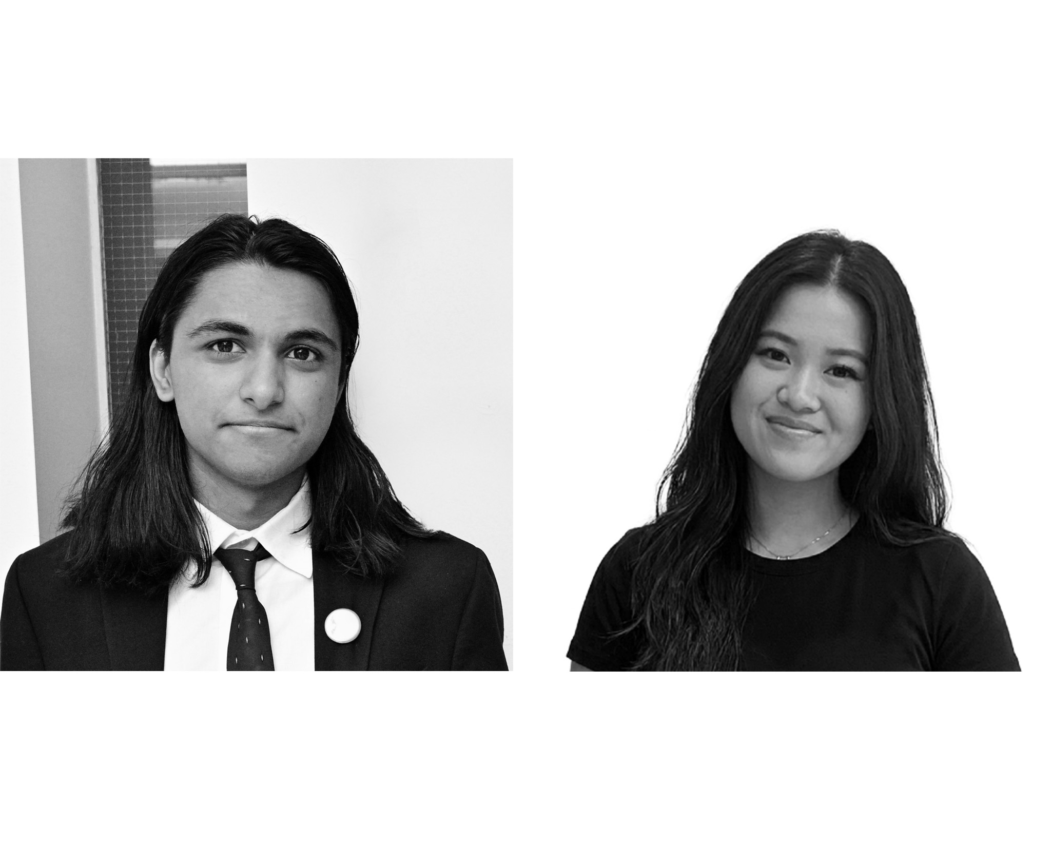 A black and white image featuring two individuals side by side. On the left, a young man with long hair, wearing a suit and tie, looks at the camera with a neutral expression. On the right, a young woman with long hair smiles softly, wearing a black t-shirt. The background is mostly plain, highlighting their faces.