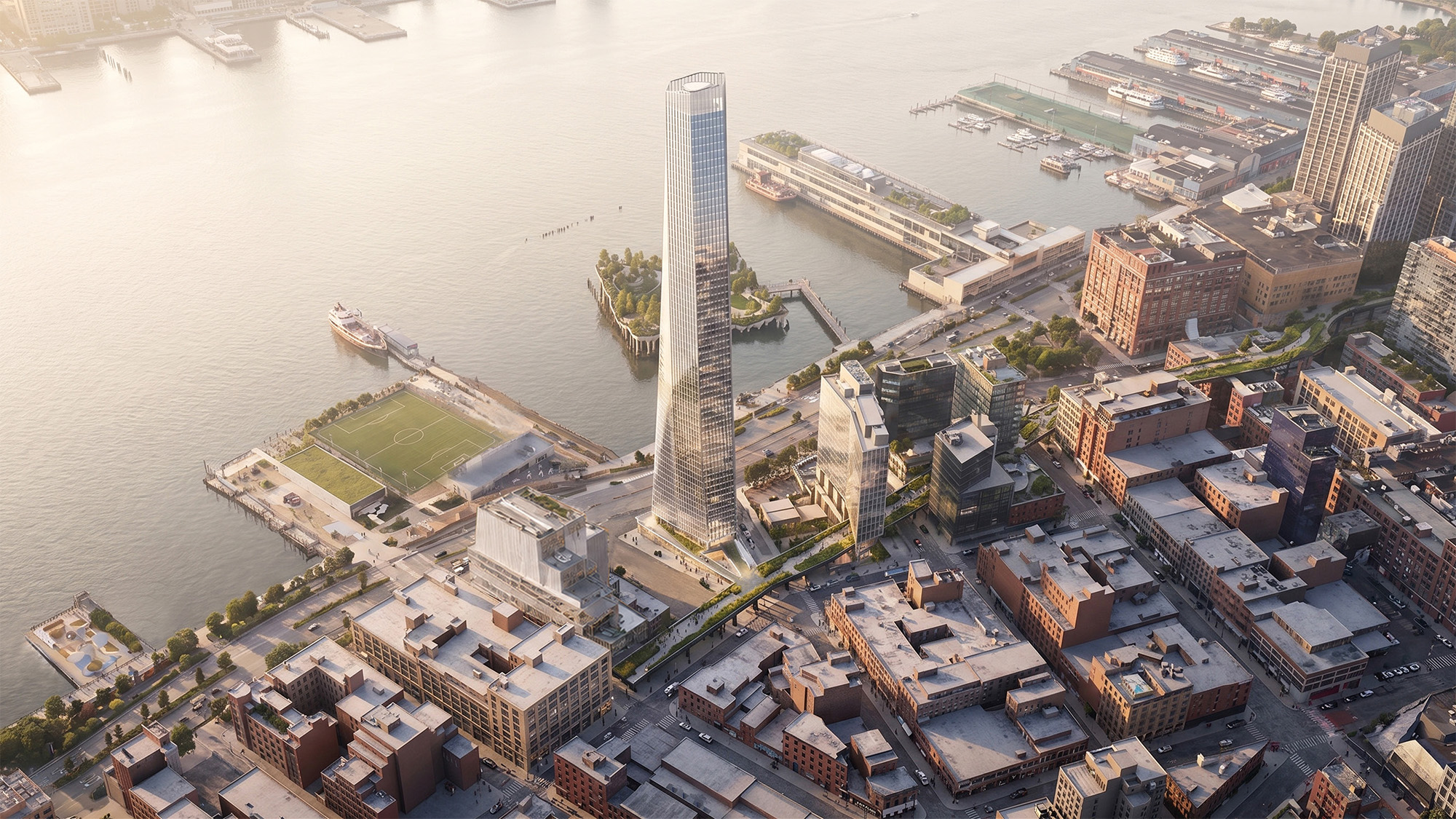 Cityscape along the water with a large tower.