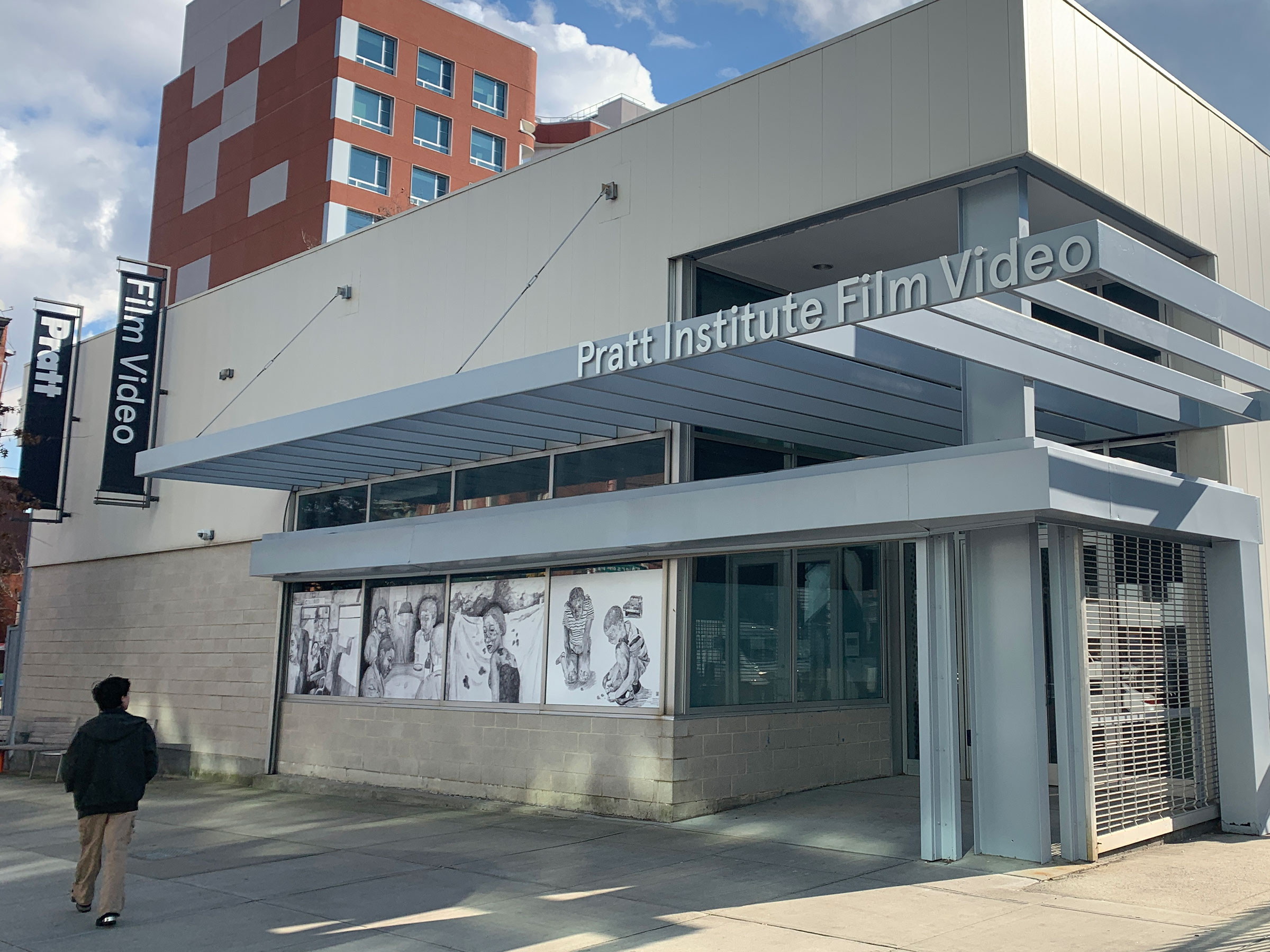 “Eyes Like Mine – (inherited longing)” by Shanoya Allwood, BFA Film/Video ’25, in the windows of the Film/Video Building on Myrtle Avenue (photo by Kate Therrian)