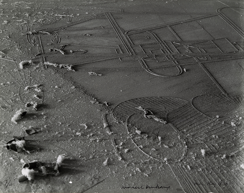 An black and white image of a floor with heavy dust on top.