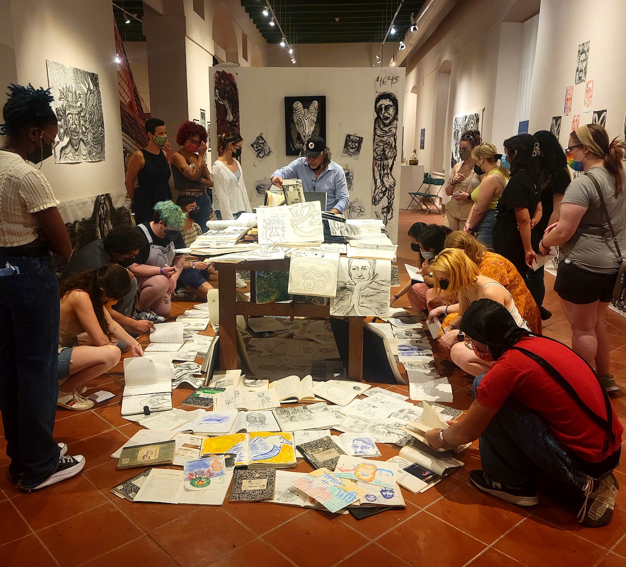 Students with Puerto Rican artist Pedro Adorno at his exhibition ‘Ecopoéticas de Agua, Sol y Sereno’ at El Museo de Las Americas in San Juan, Puerto Rico