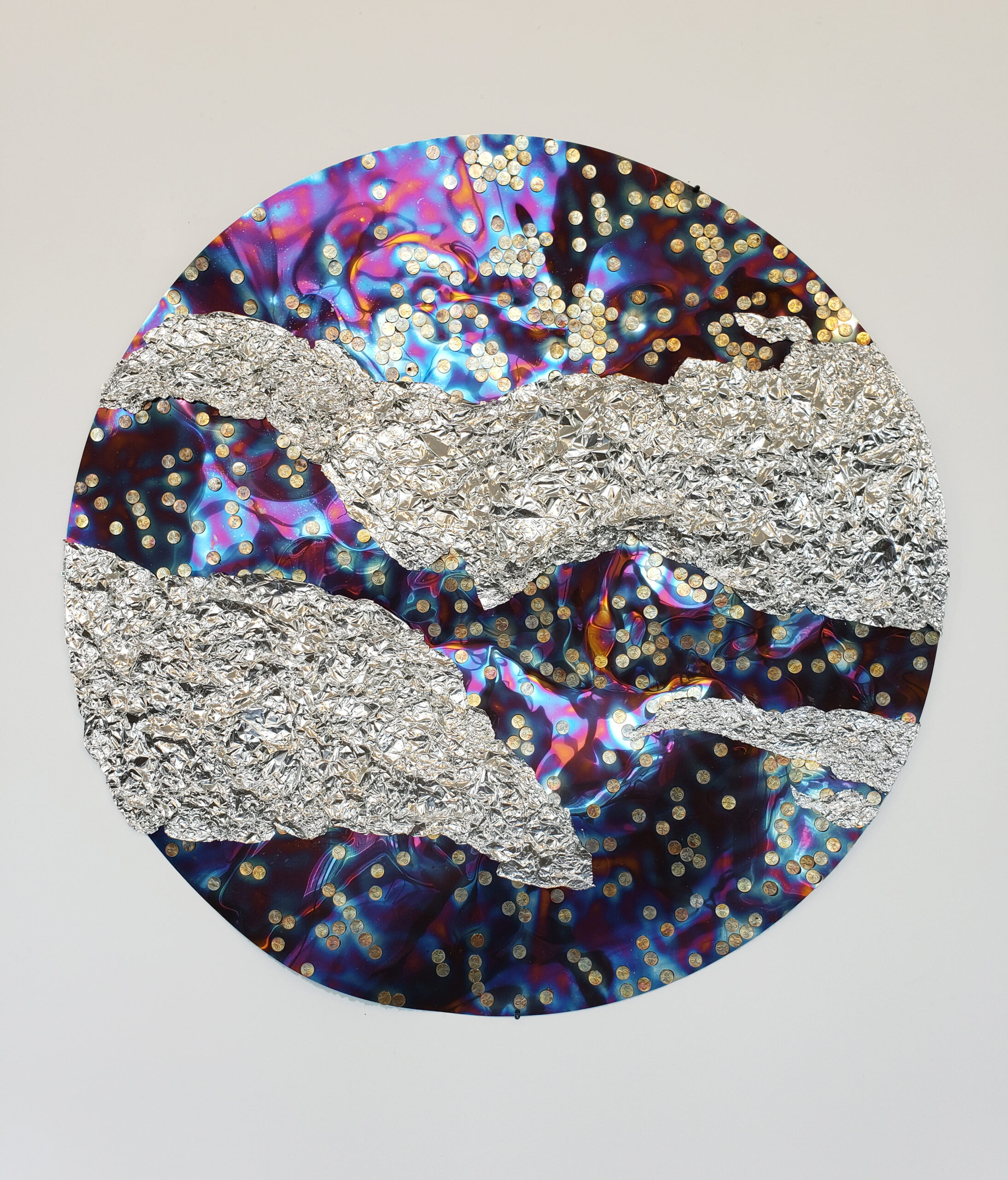 artwork with a sphere, made of shiny sequin like markings