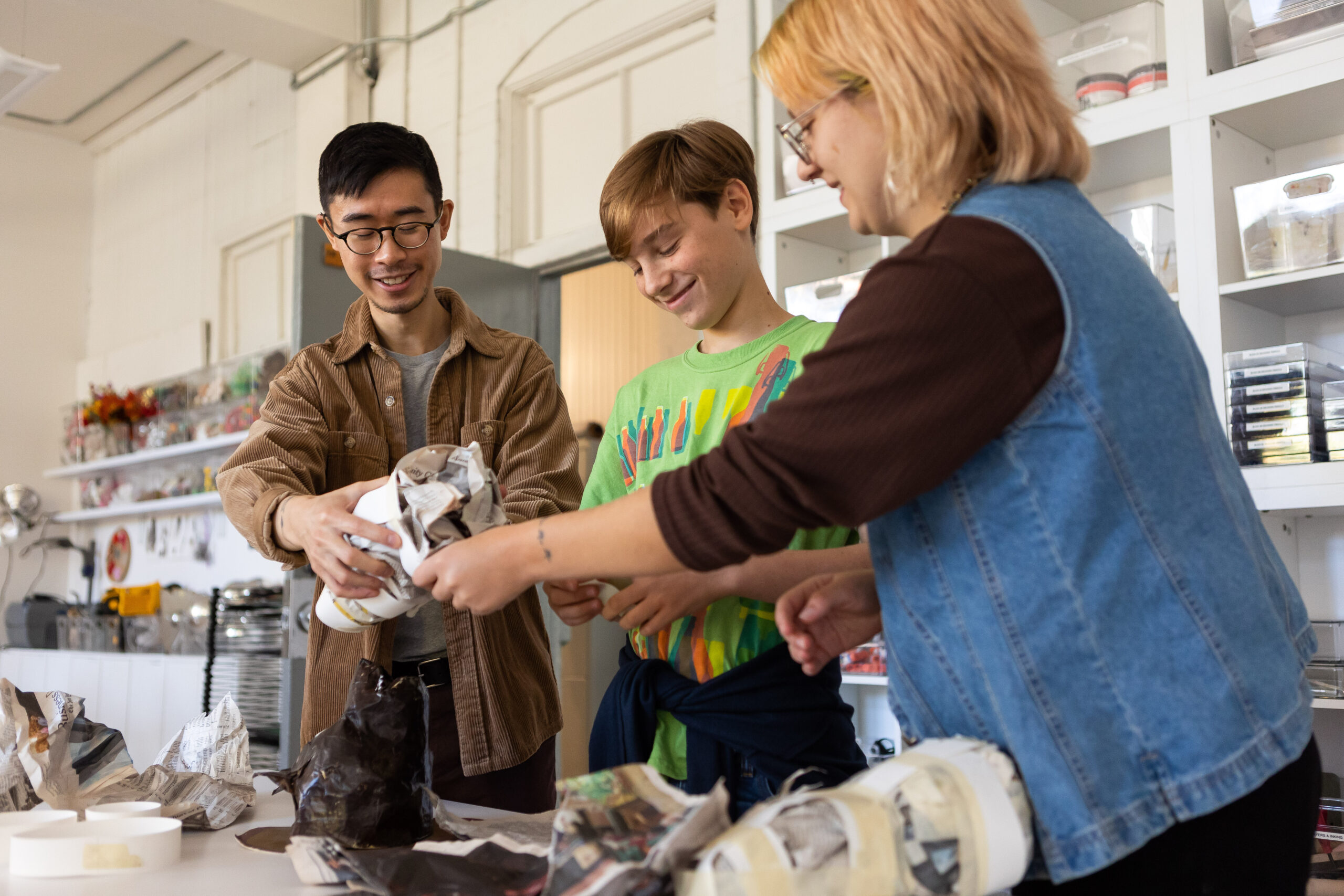 Kelvin Tse and Molly Burki (MA Art and Design Education, 2023) working with a middle school student