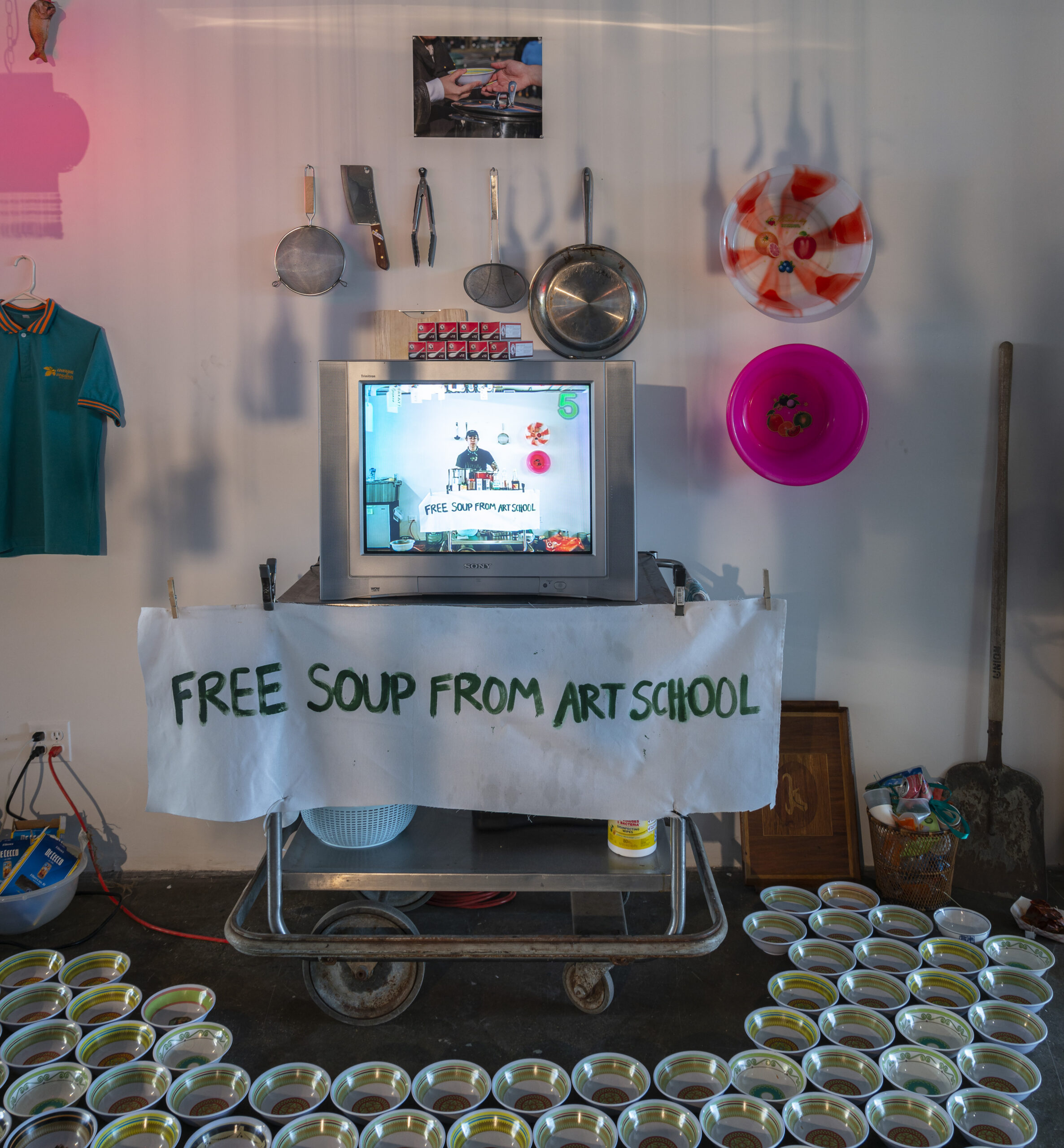 installation from dan pravit fethke, consisting of a vintage imac computer, on a table, with a banner on that reads