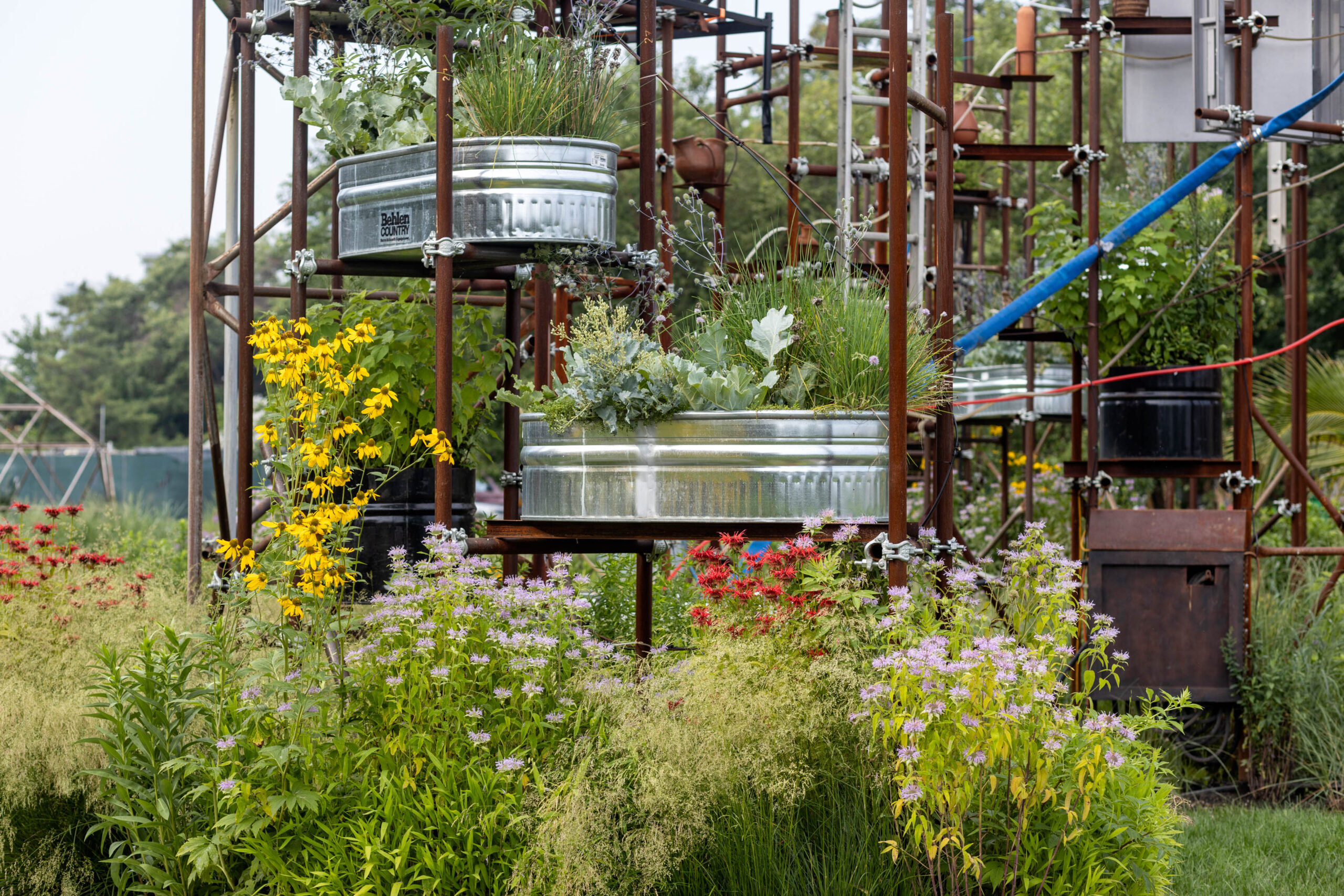 repurposed washtub made of metal, constructed to be planters