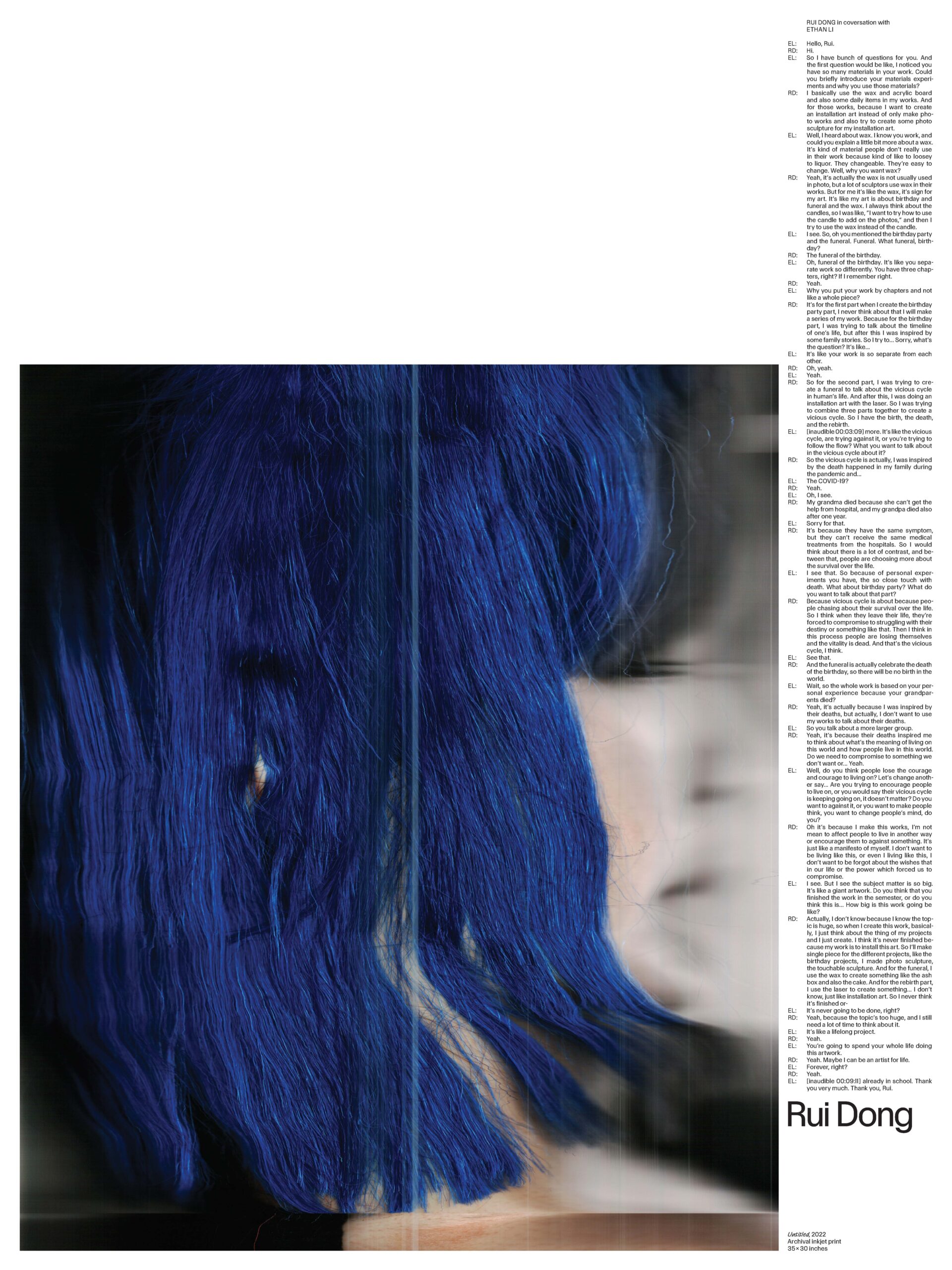 A close-up photo of what appears like blue-dyed hair. A small part of the subject's ear protrudes through the hair. There appear to be printer lines running vertically on the image.