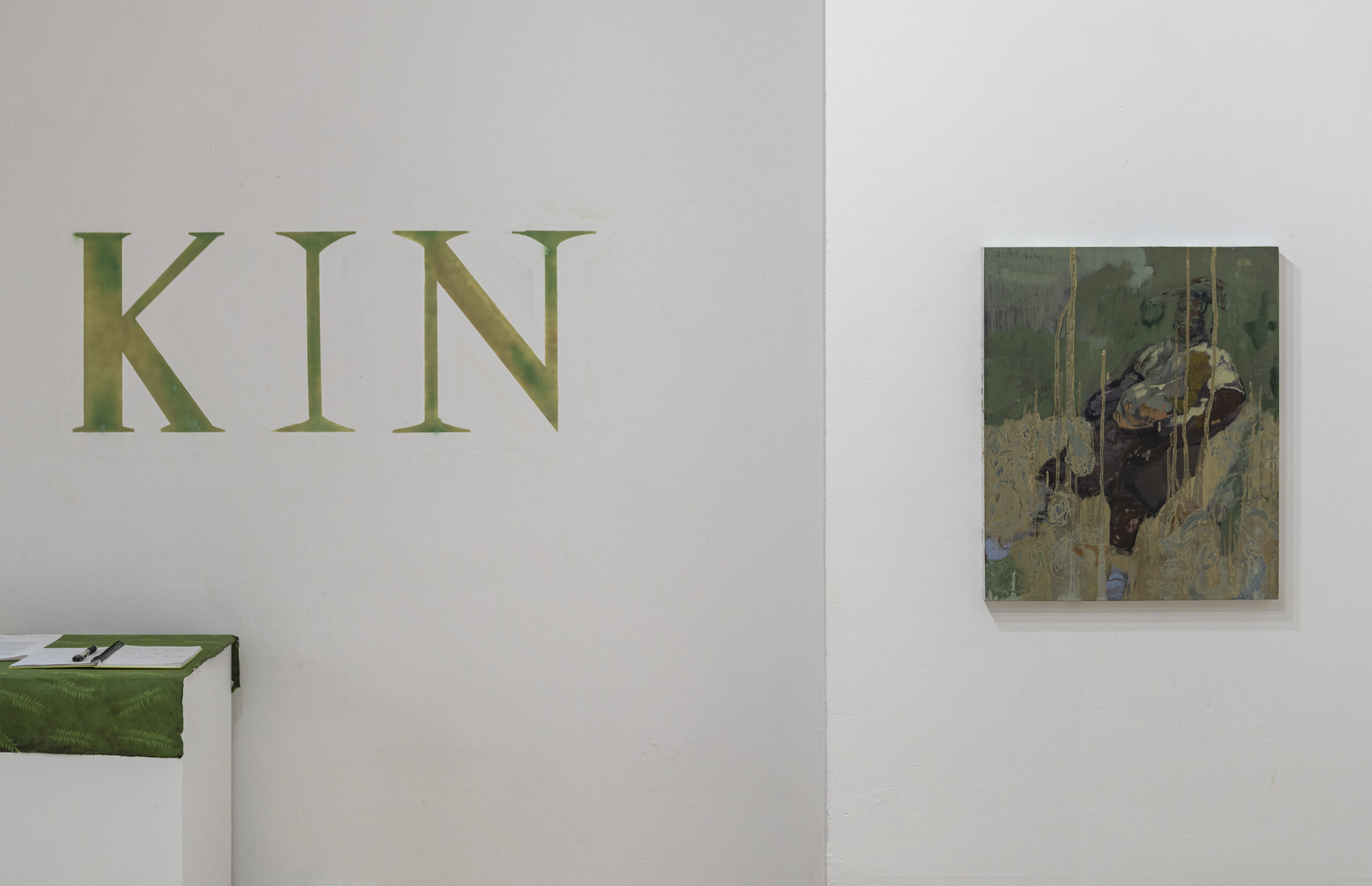 A close-up view of an exhibition entrance with the word 