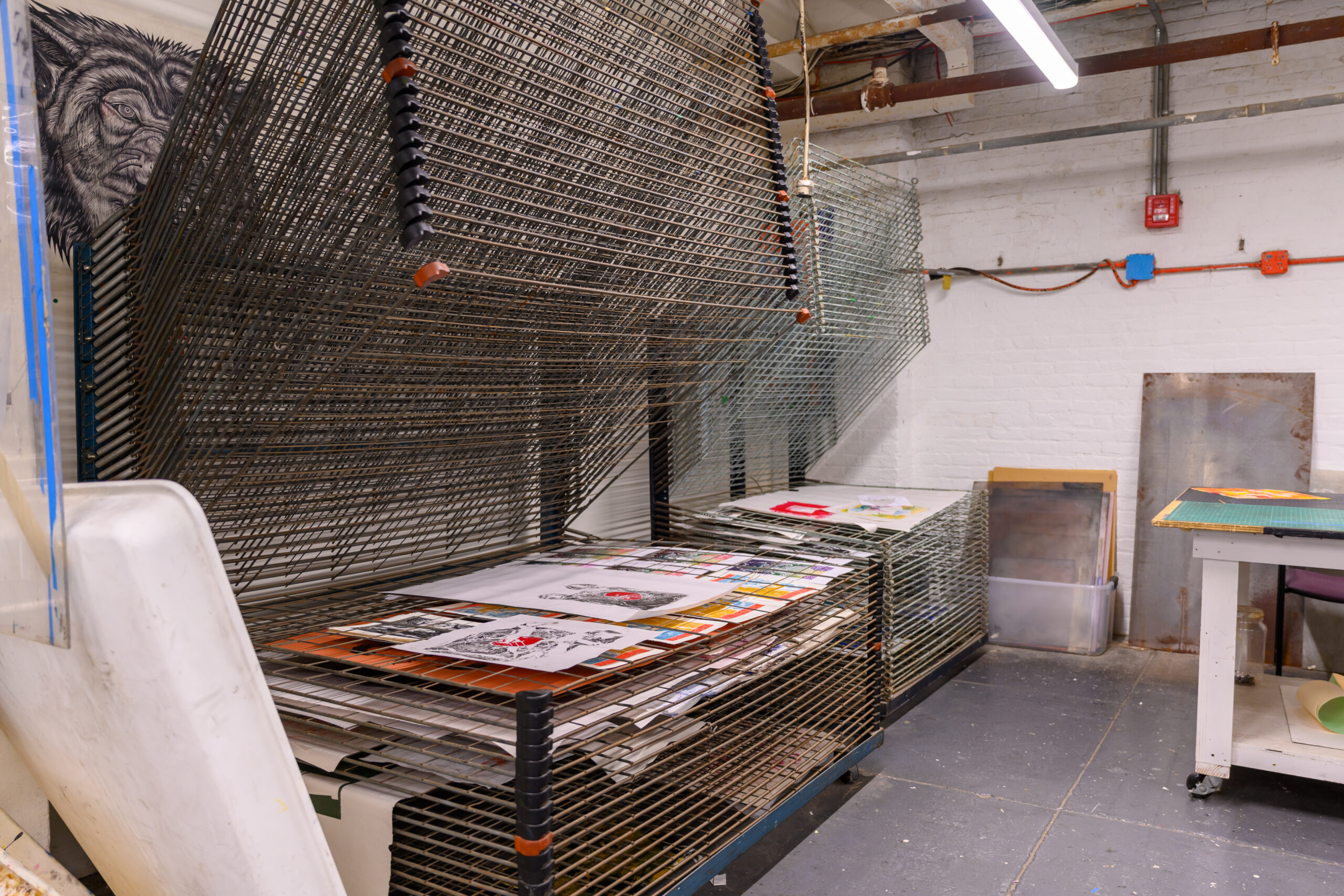 Fine Arts printmaking drying racks with prints drying