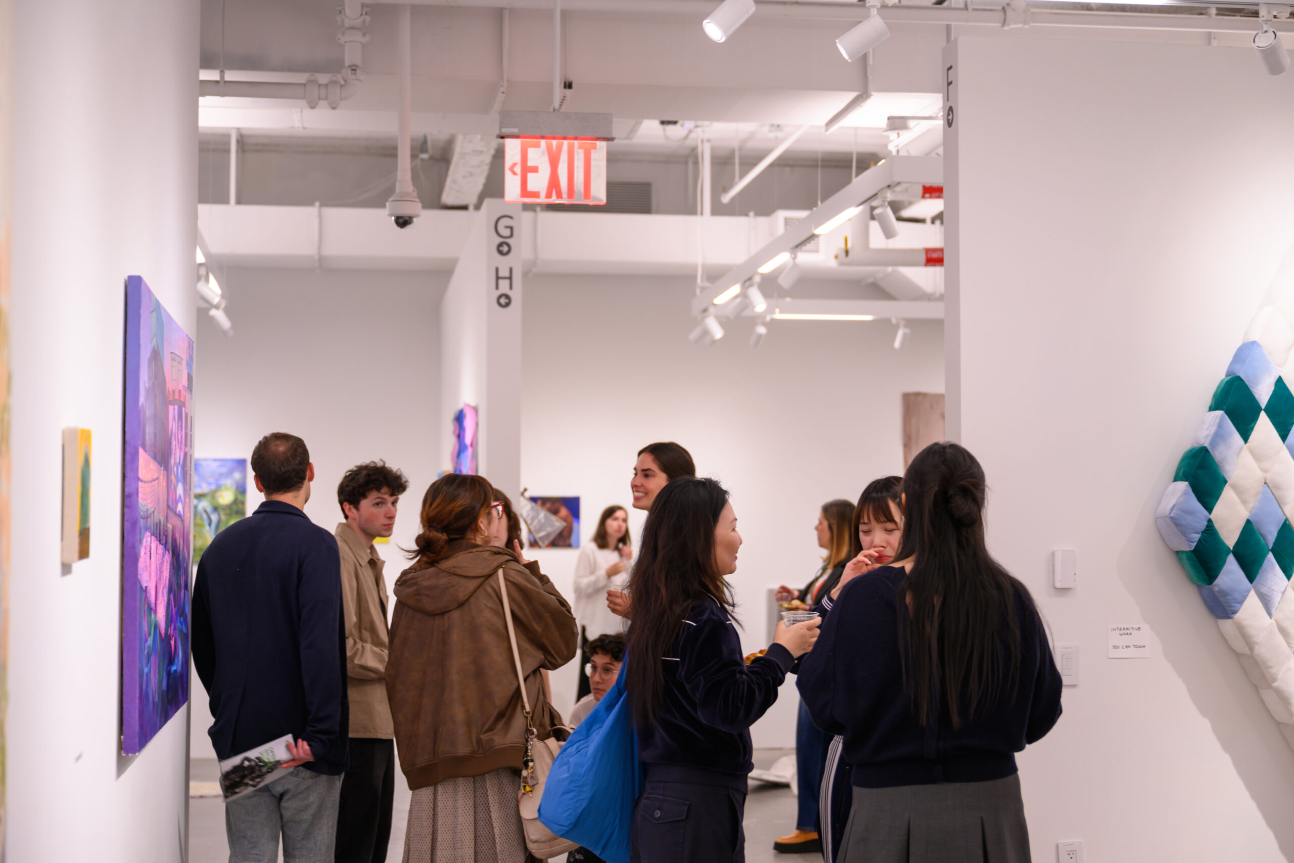 A group of Pratt Fine Arts MFA students in the Dock 72 galleries