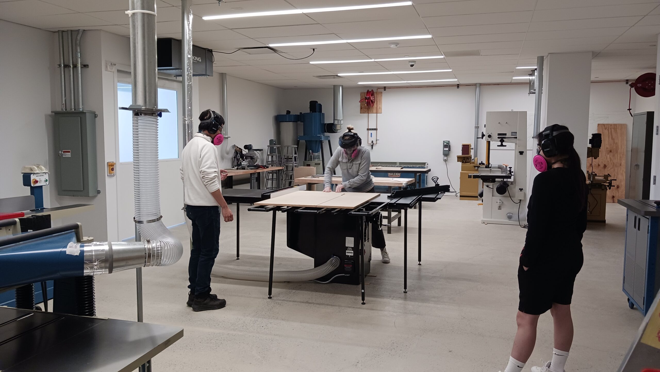 Students working in Graduate Fine Arts wood shop at Dock 72