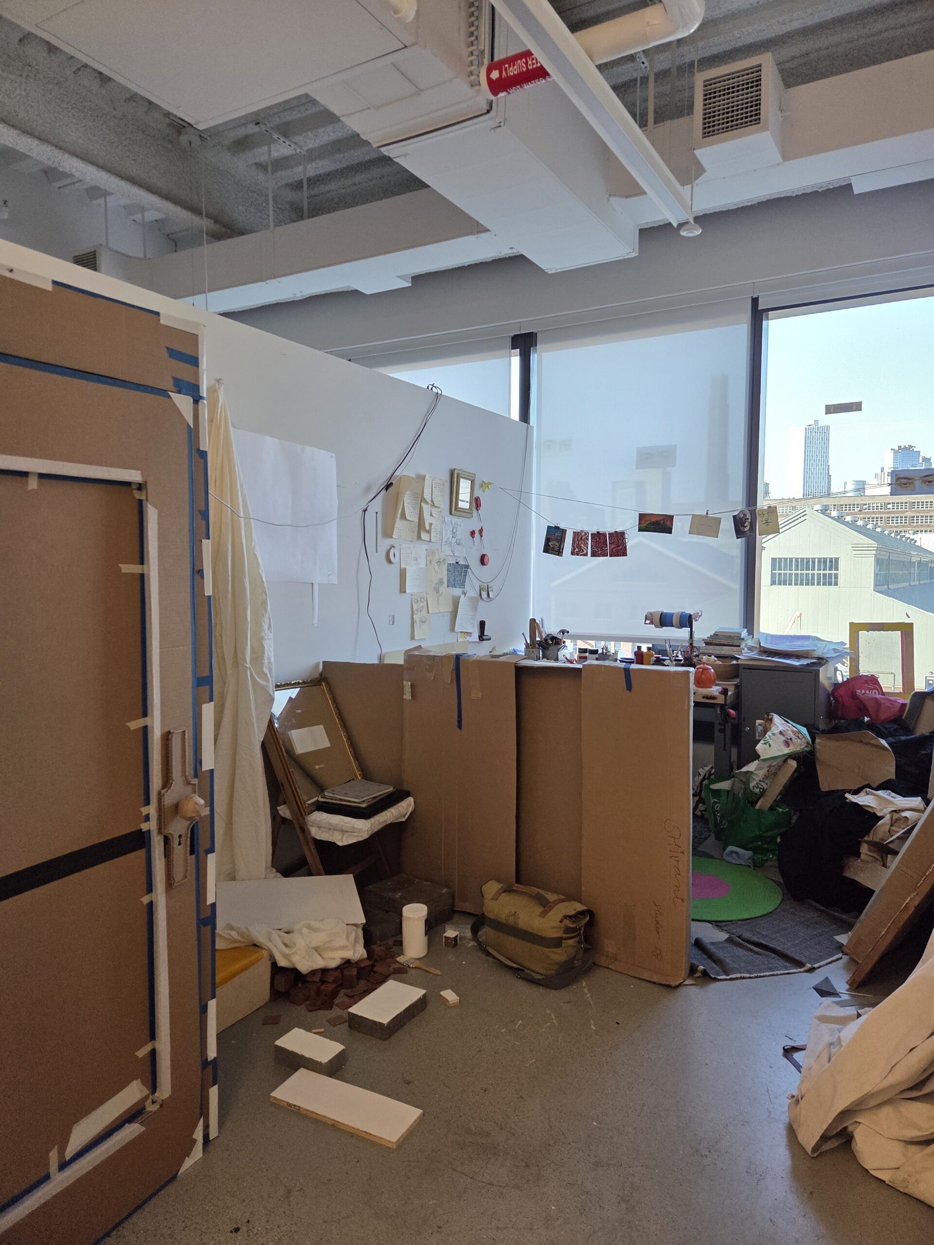 Fine Arts MFA studio at Dock 72. There are various forms in cardboard.