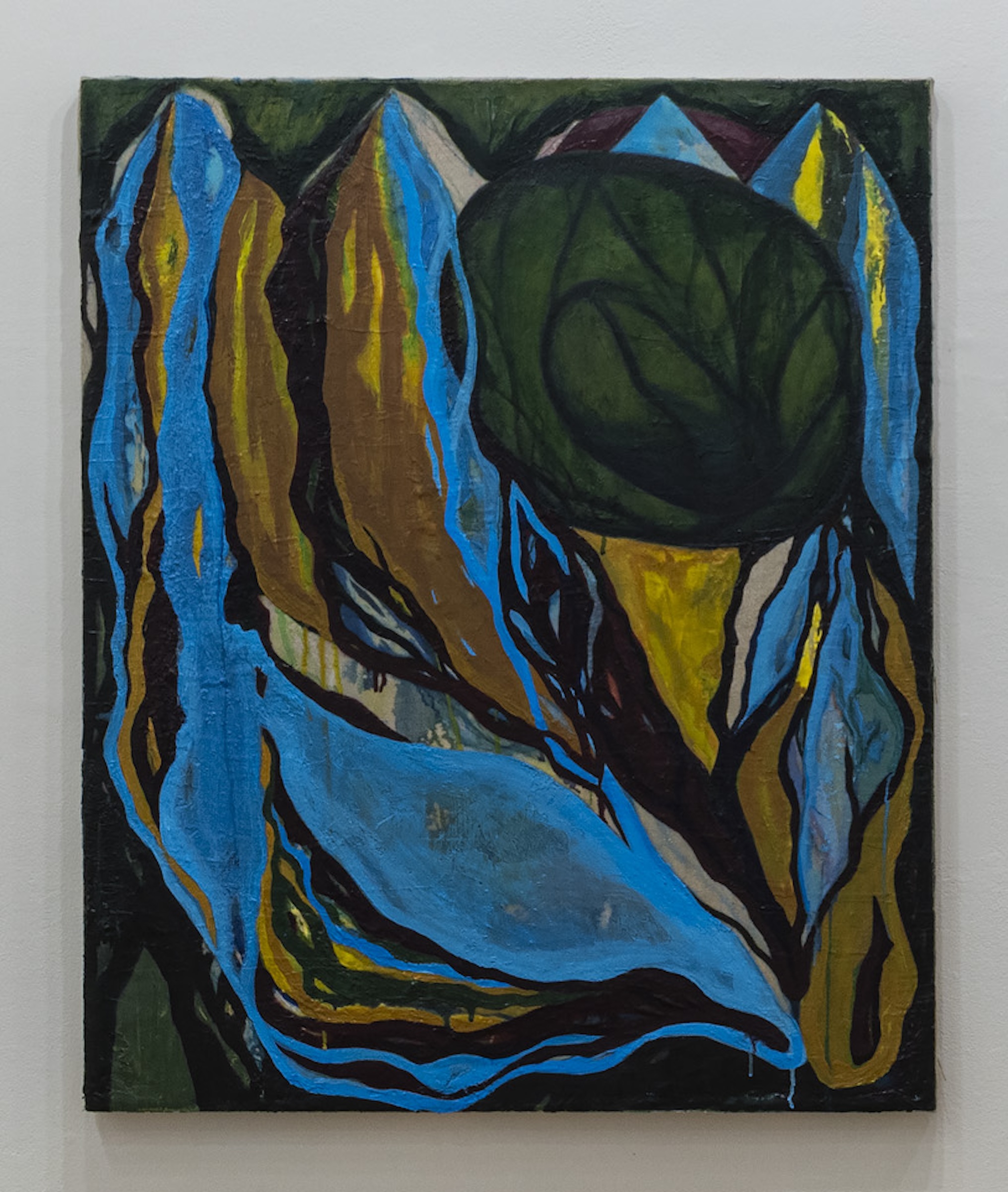 An abstract painting featuring bold, contrasting colors. Shapes resembling mountains in blue and brown are set against a dark green background. A large, dark green circular form, reminiscent of a leaf, is situated centrally. The artwork employs thick, expressive brush strokes and includes hints of yellow and lighter blue, blending organic and geometric forms to create a dynamic visual composition.