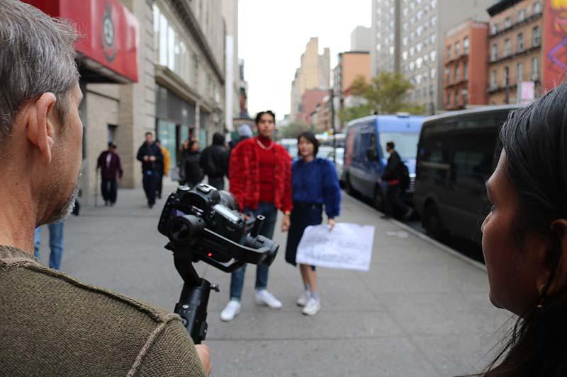 People walking down a NYC street, by pratt Manhattan campus