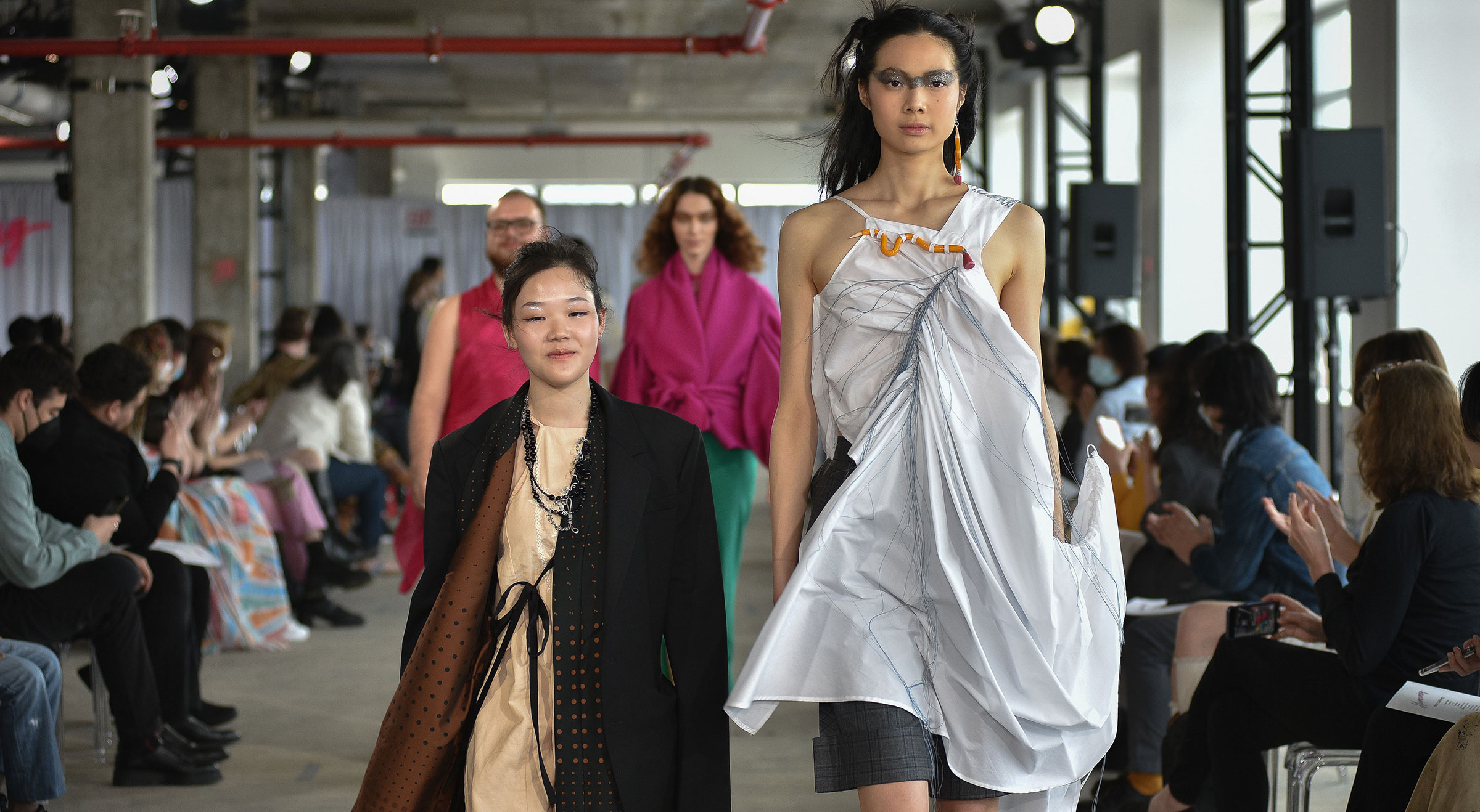 Designer Dan Li, with a model in one of her award winning creations.