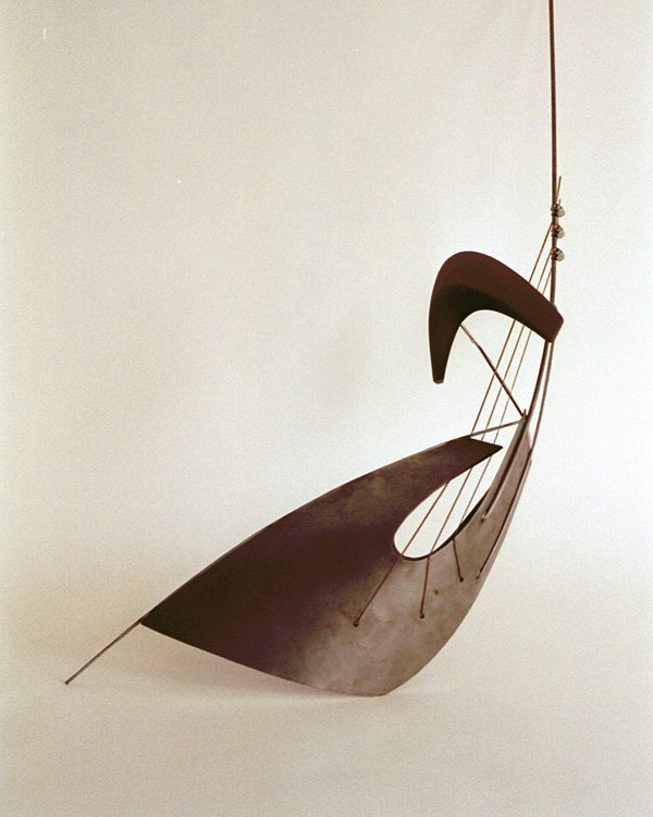 an abstract guitar composed of curved flat planes