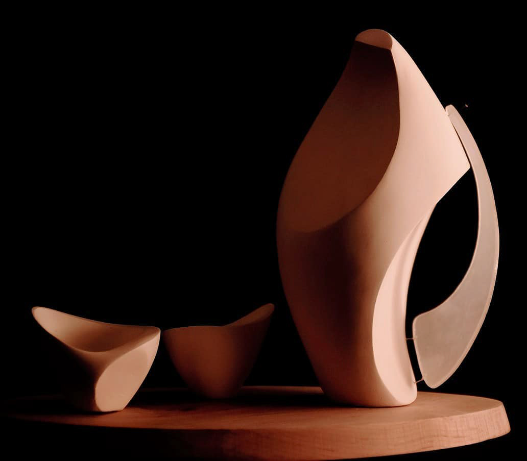 a color photograph of a studio exercise featuring balanced terracotta fragmentary forms