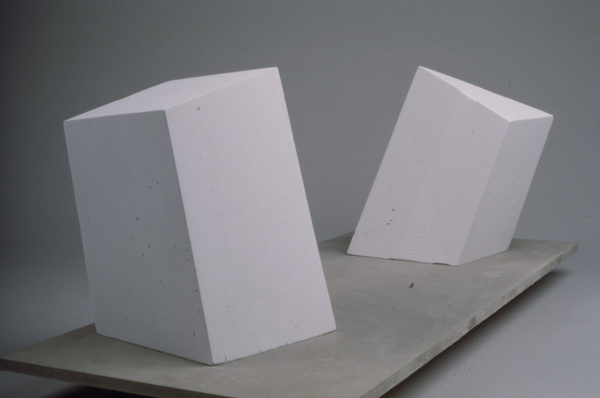 a color photograph of a studio exercise featuring two balanced fragmentary forms