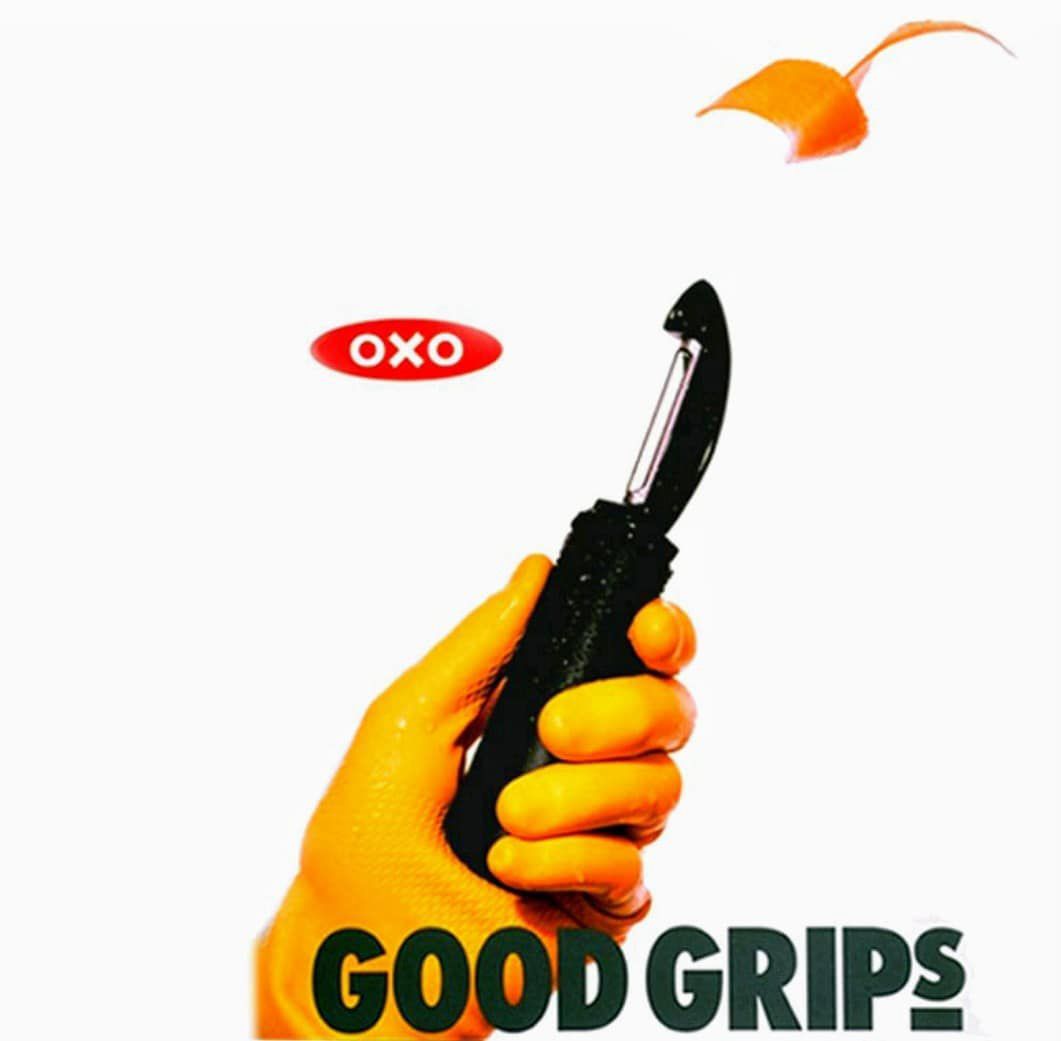 an advertisement for a potato peeler showing the peeler in an orange gloved hand
