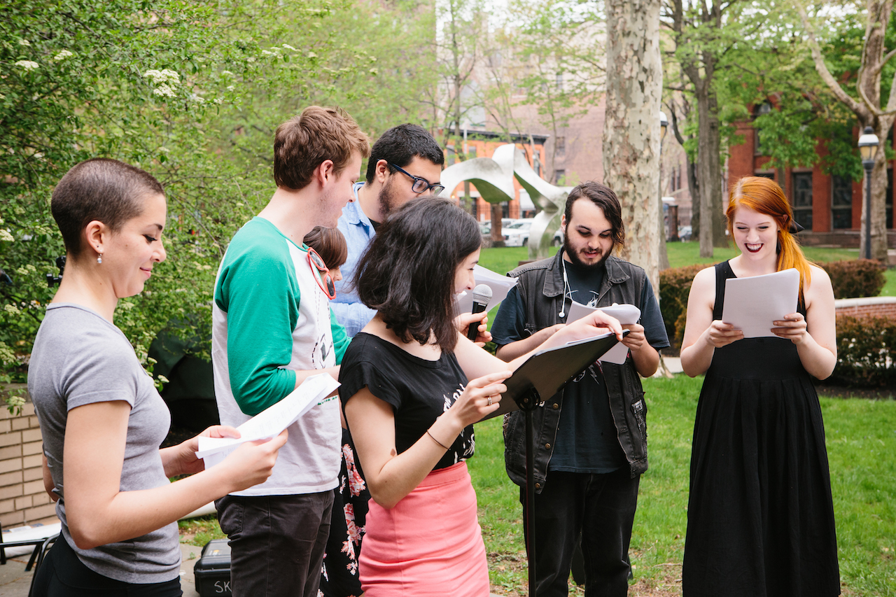 students standing on pratt lawn, exchanging ideas