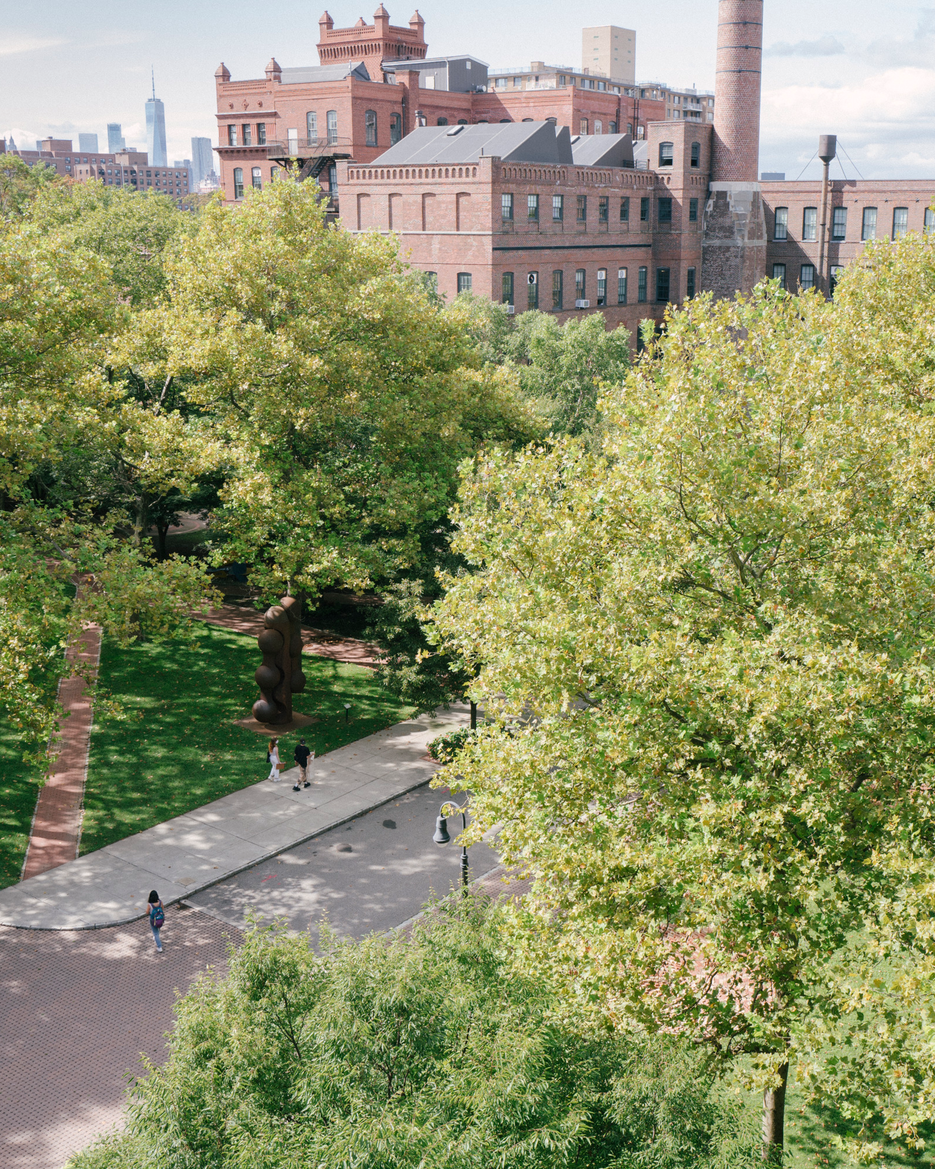 An aerial view of Pratt Brooklyn campus showing leafy trees and brick buildings.