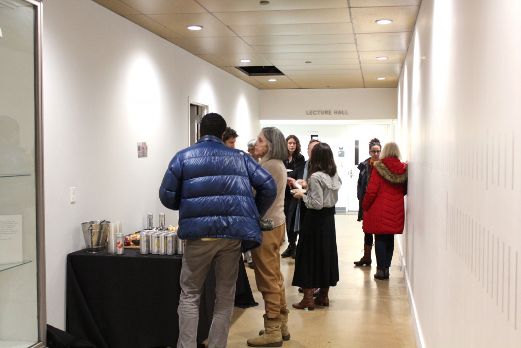 people gathered in a gallery