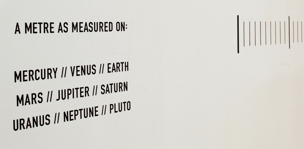 image of art work on wall, from the work 'Metric Units for the Solar System'