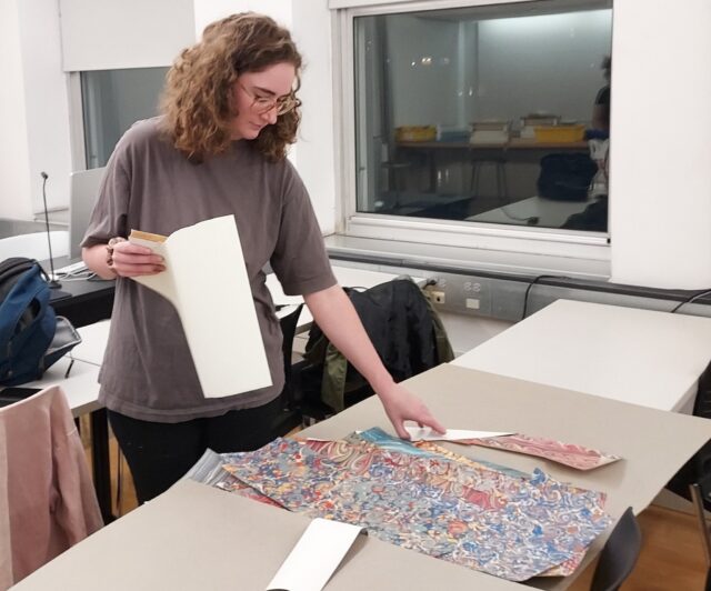 Students in INFO 634 Conservation Lab with Prof. Slava Polishchuk work on creating custom enclosures for rare books this semester.