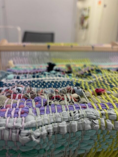 Some photos of the beginnings of our collaborative textile for the cannoneer library, created with @arthurkay_art in their grief weaving workshop! If you’d like to contribute, the prompts and fabric are in the mart space. Deposit your fabric in the box and we’ll weave them in ✨