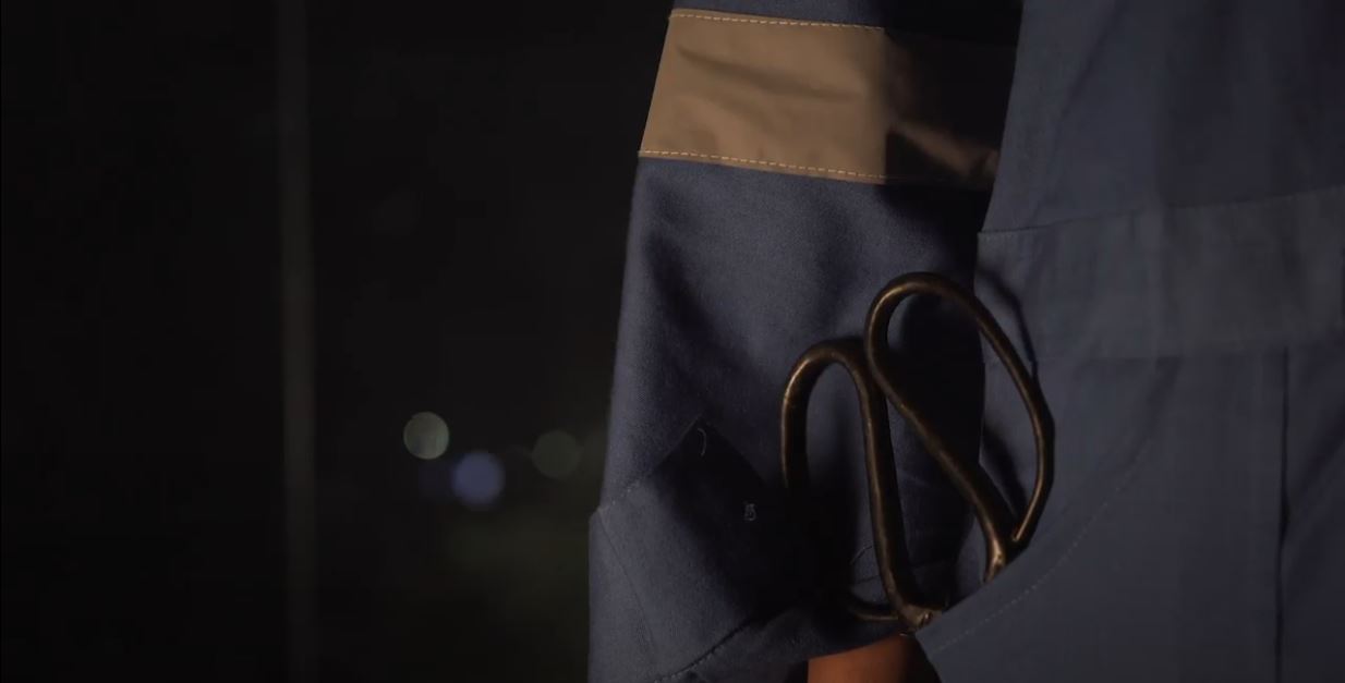 handmade scissors sticking out of a pocket