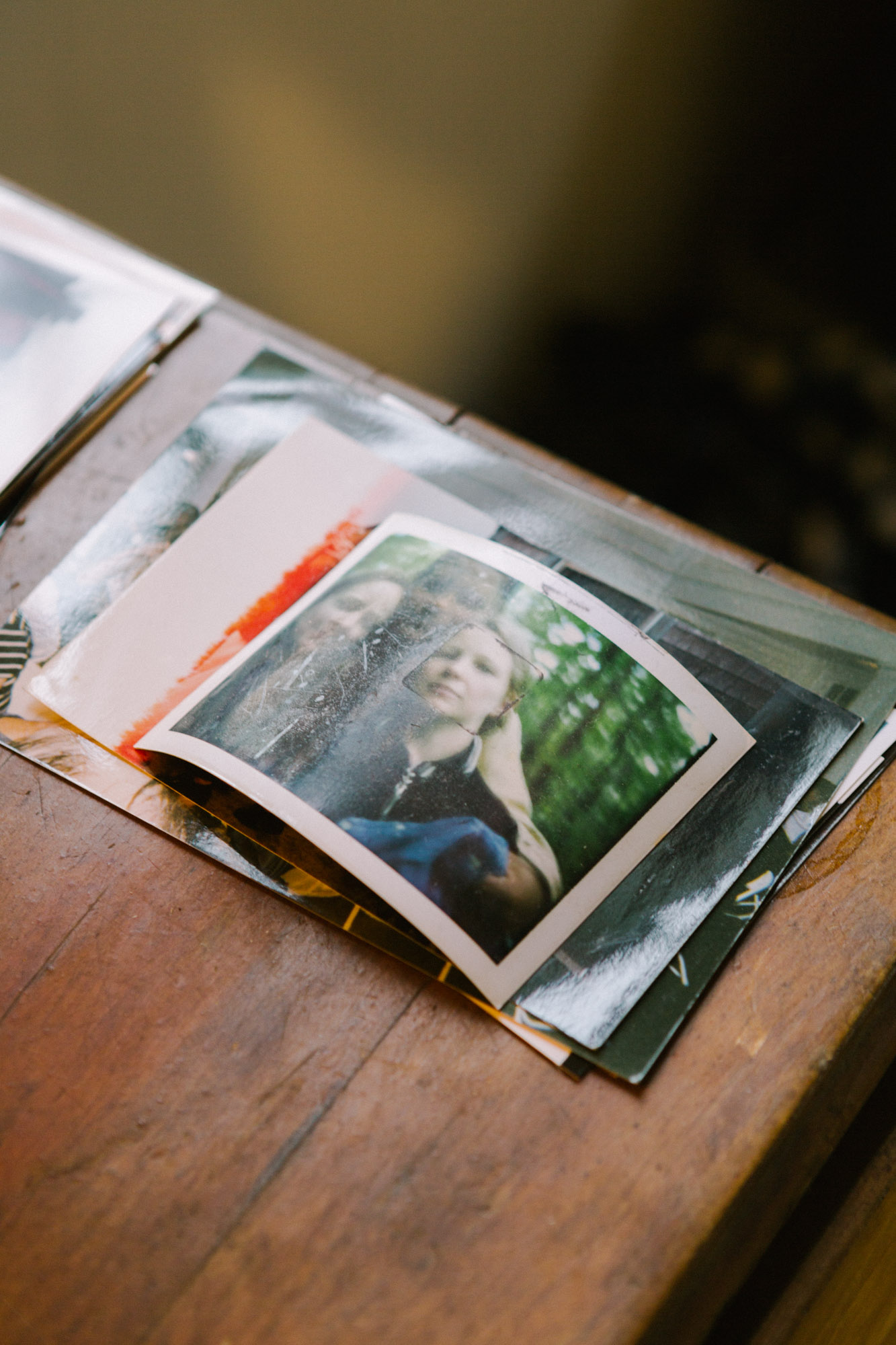 A stack of glossy color photograph prints