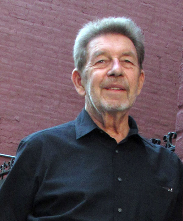 Picture of Pete Hamill with the Patchin Place street sign, photographed by Deirdre Hamill, Quest Imagery