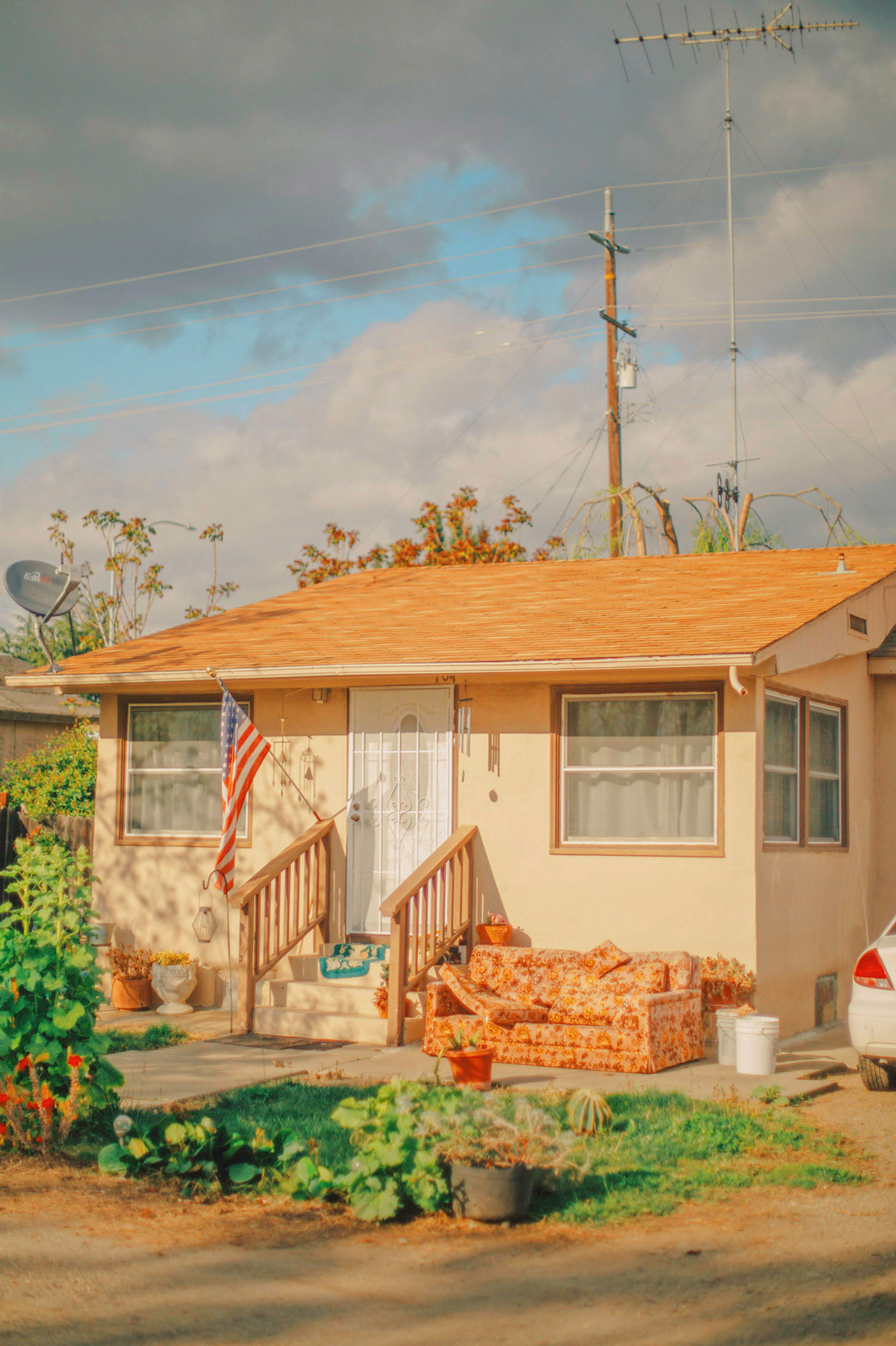 picture of a house with an american flag near the door