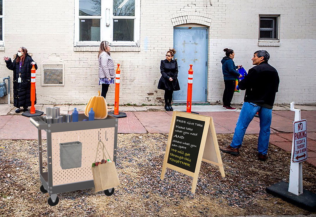 People wait on line along the outside of a building where a wheeled cart holds free items to take