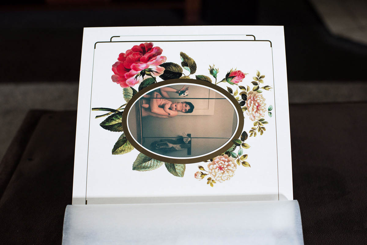 Horizontal picture of a mother and child with flowers around the frame