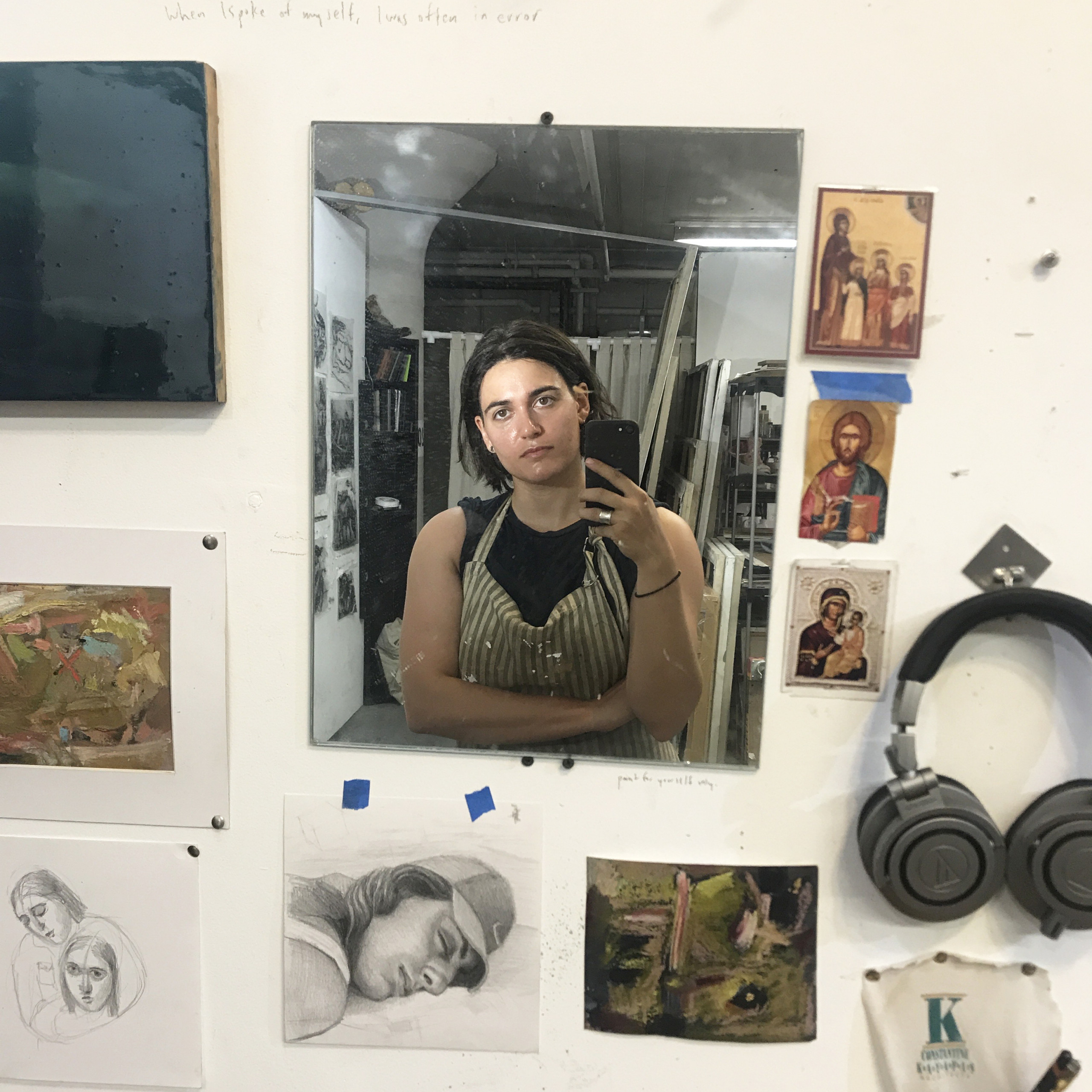 Artist Sophia Kayafas photographs herself in a rectangular mirror