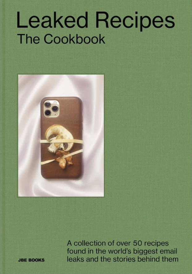 Cover of Leaked Recipes: The Cookbook, with smartphone and sliced mushrooms wrapped in rubber bands on satin background.