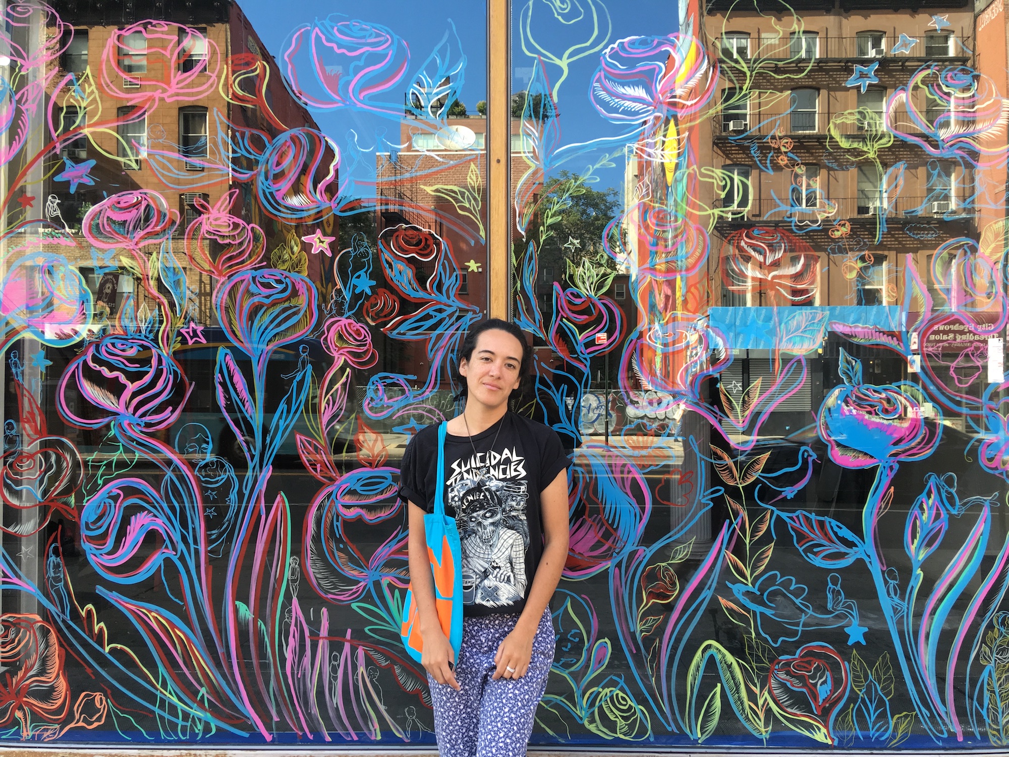 Image: Maria de Los Angeles with her mural at the Pratt Manhattan campus (photo by Ryan Bonilla)