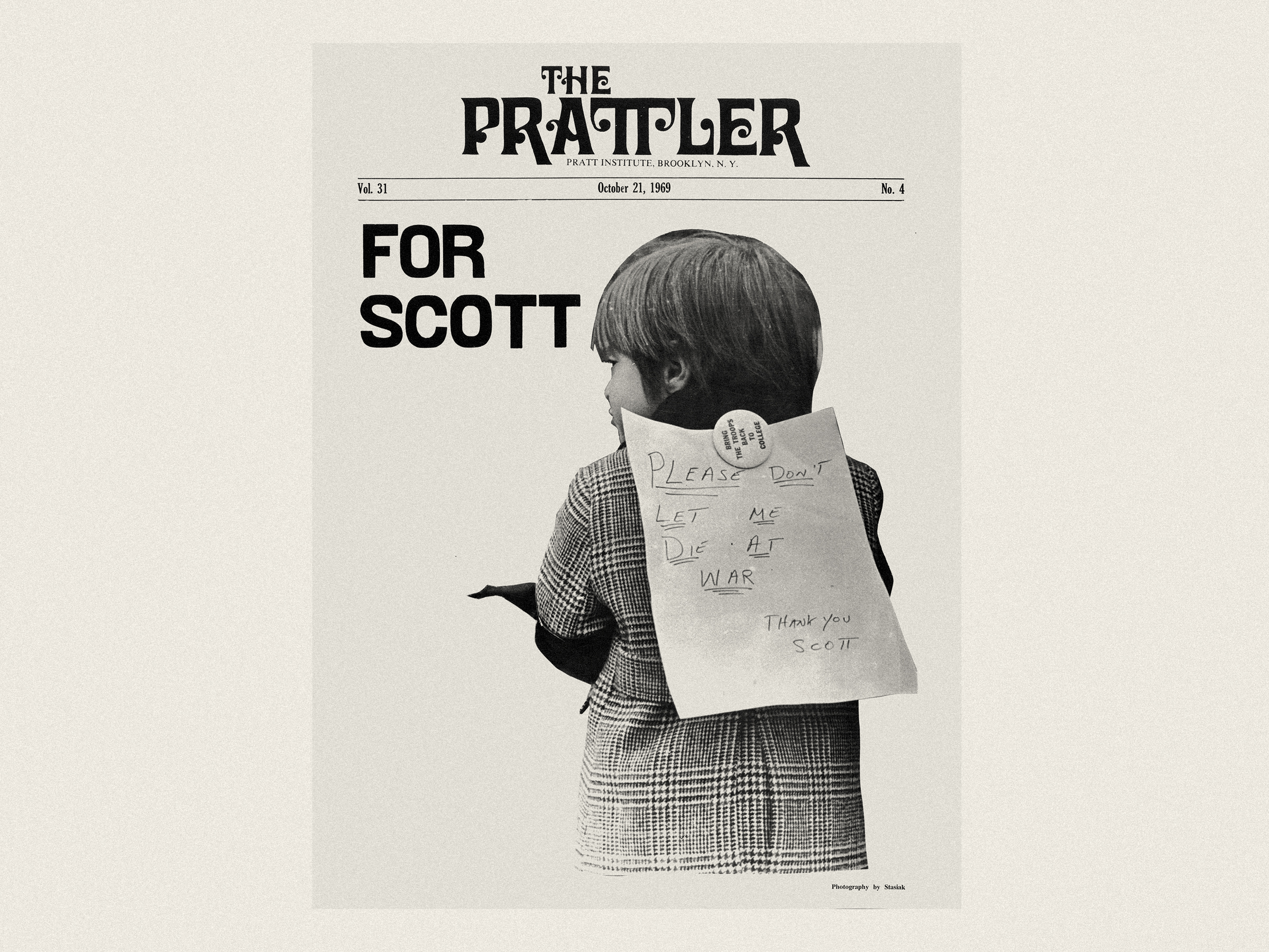 The Prattler newspaper cover showing a young child wearing a sign protesting war