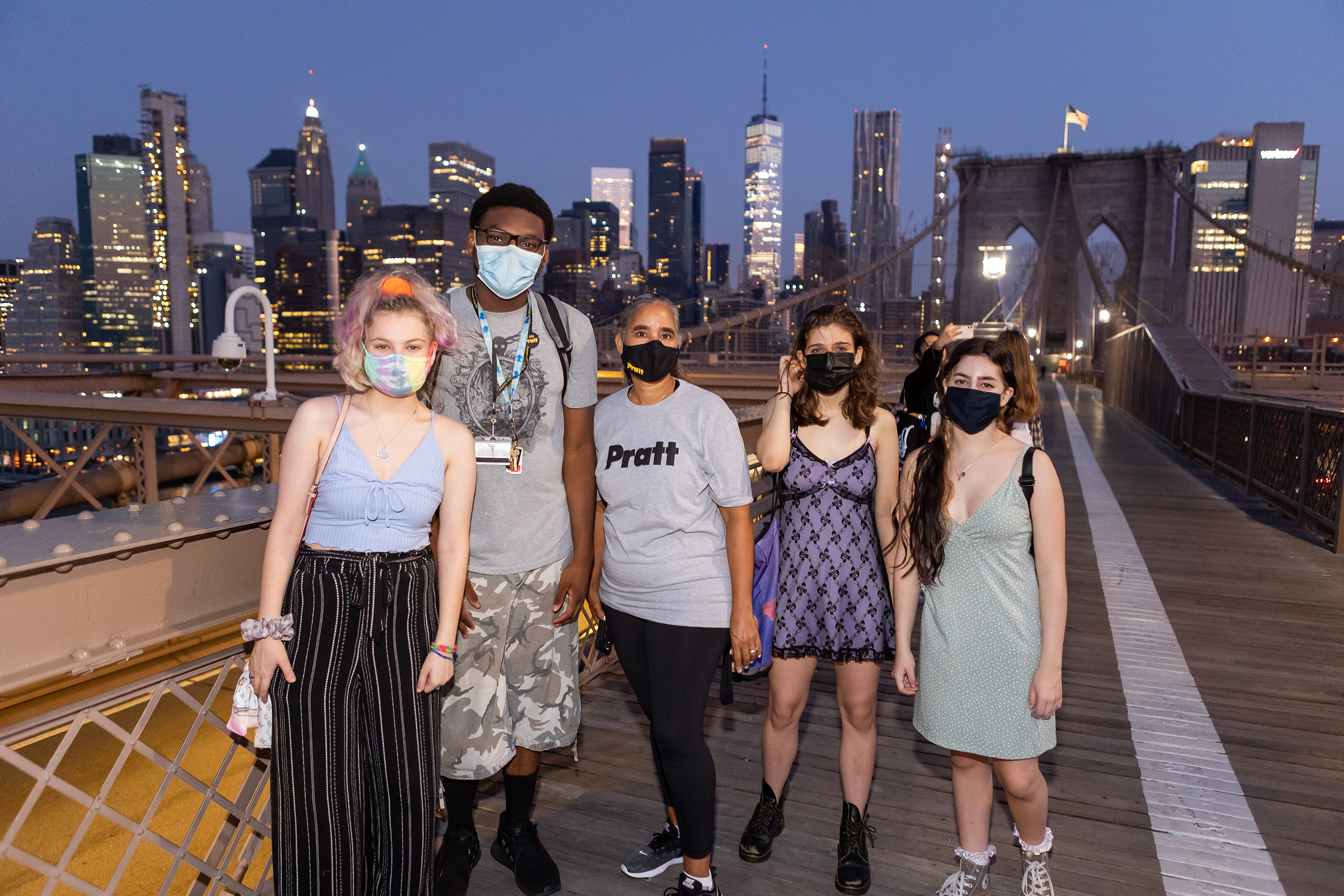 Delmy M. Lendof, vice president for student affairs, with students just before sunrise on the Brooklyn Bridge (photo by Sam Stuart Hollenshead)