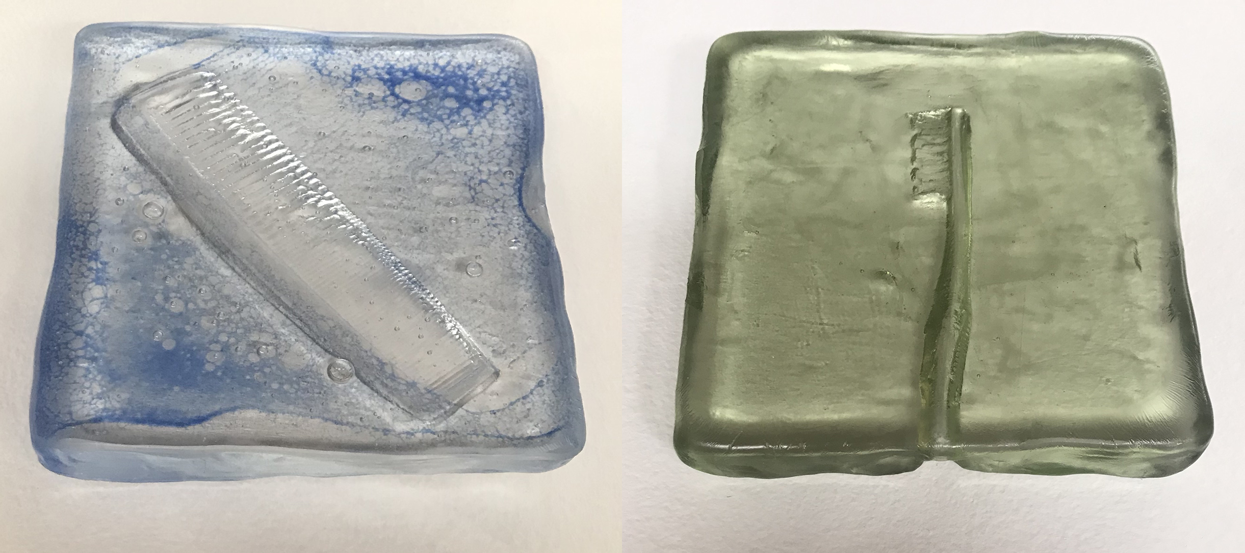 Impressions of a comb and toothbrush in squares of dimpled glass